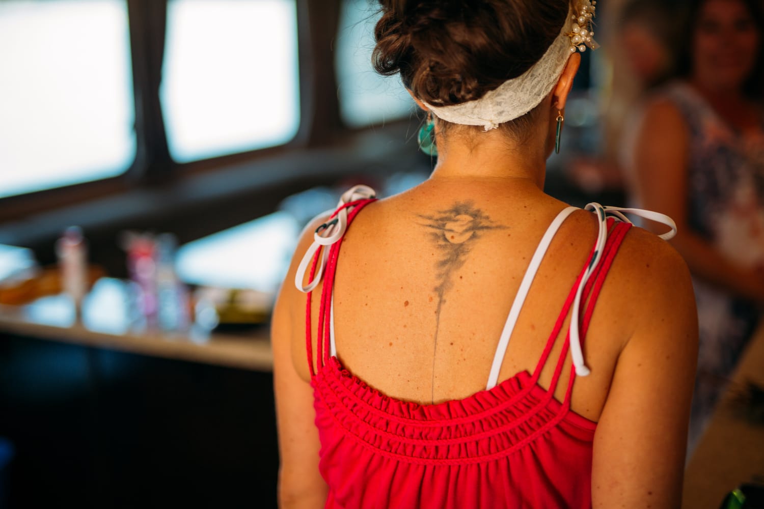 Carmel and Chris weddings story frame 8: A Sicamous and Shuswap Lake houseboat wedding that moved from water to beach, with friend-community overlap and a relaxed lakeside feeling..