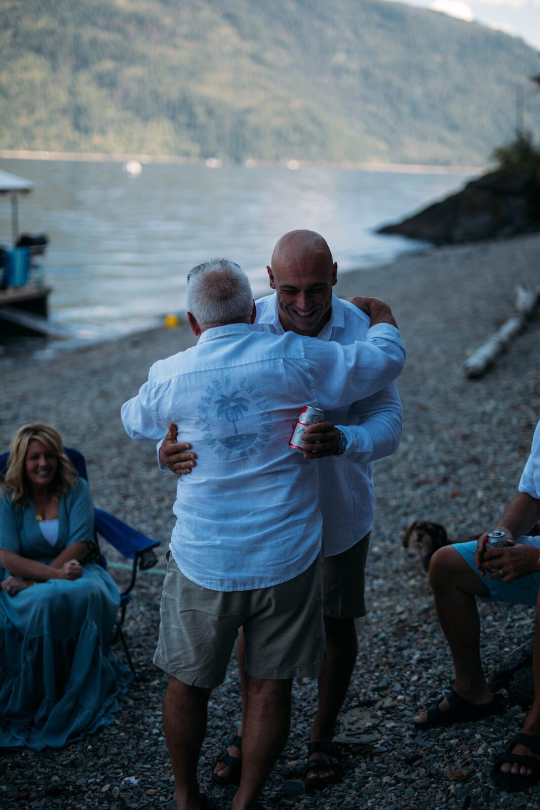 Carmel and Chris weddings story frame 9: A Sicamous and Shuswap Lake houseboat wedding that moved from water to beach, with friend-community overlap and a relaxed lakeside feeling..