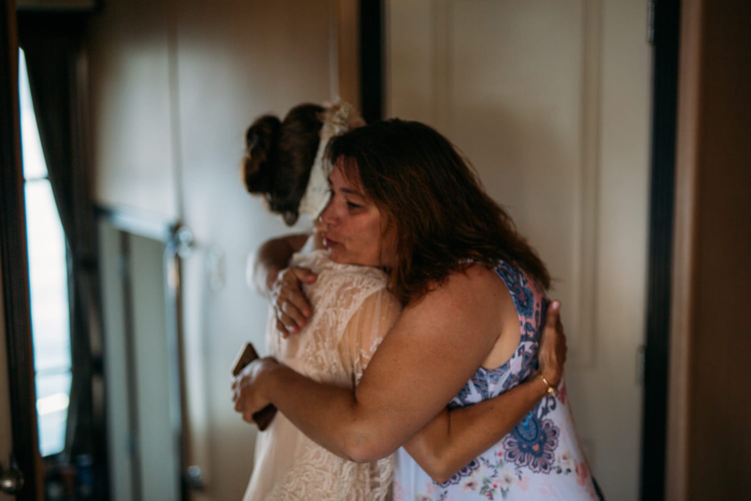 Carmel and Chris weddings story frame 11: A Sicamous and Shuswap Lake houseboat wedding that moved from water to beach, with friend-community overlap and a relaxed lakeside feeling..