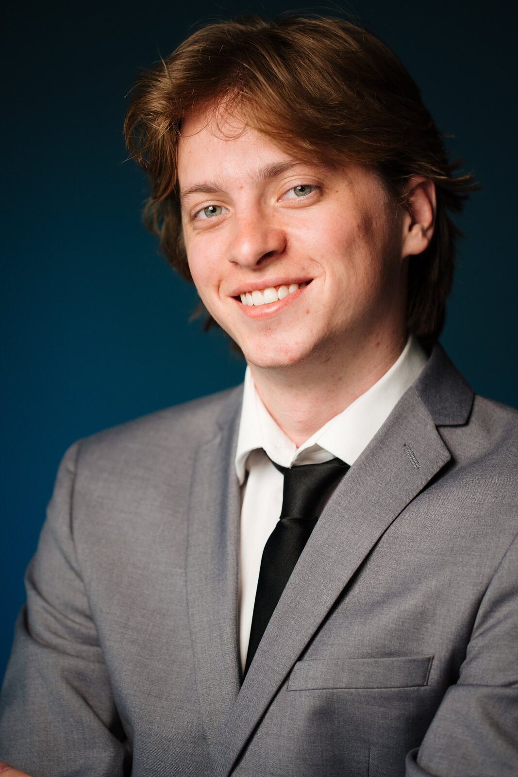 CATO Redux actor headshot on blue, photograph 5