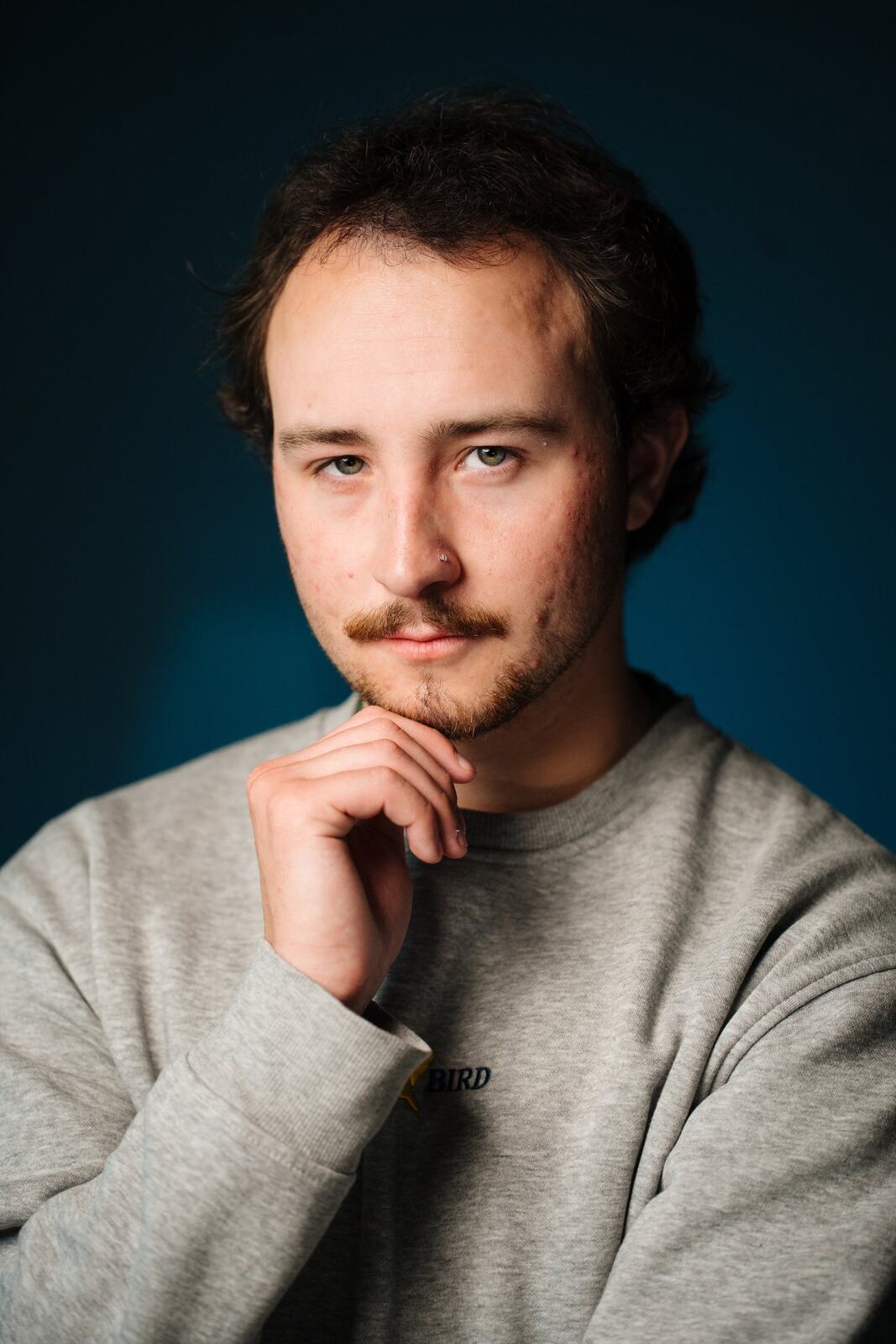 CATO Redux actor headshot on blue, photograph 17