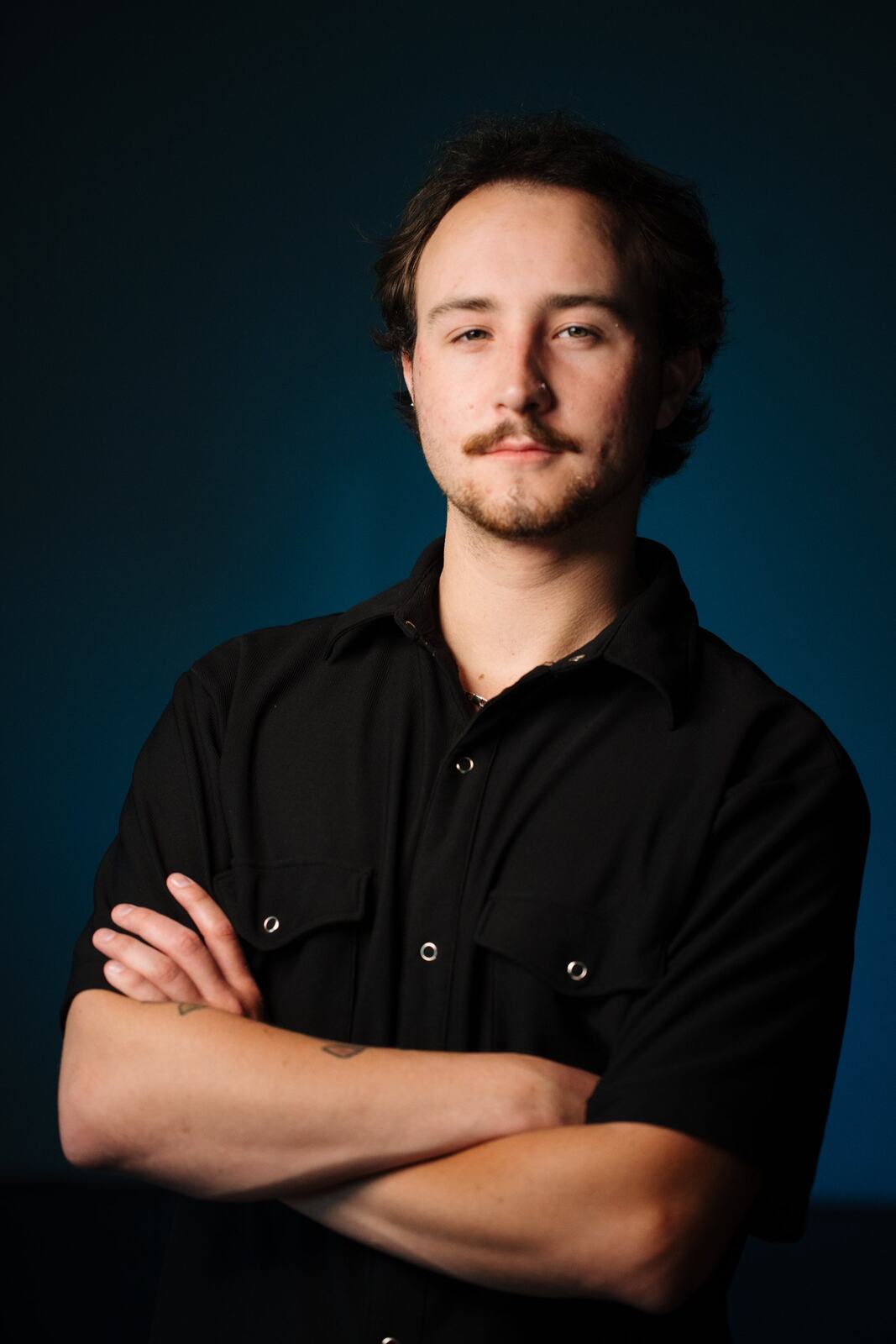 CATO Redux actor headshot on blue, photograph 18