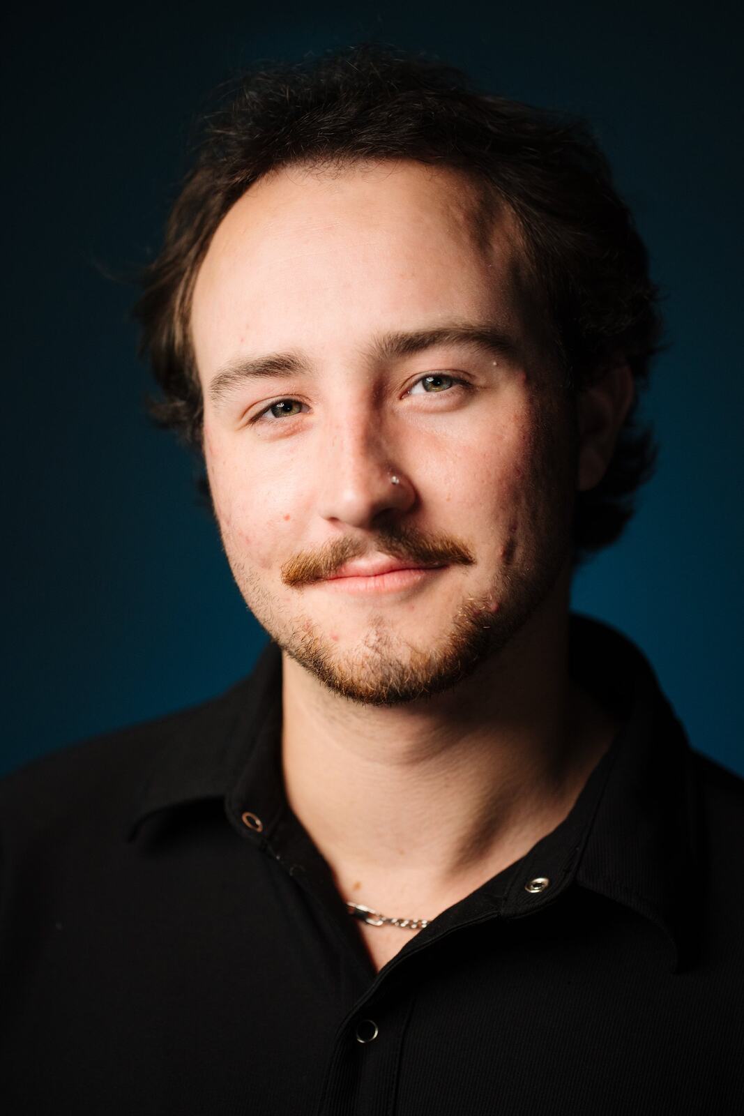 CATO Redux actor headshot on blue, photograph 19