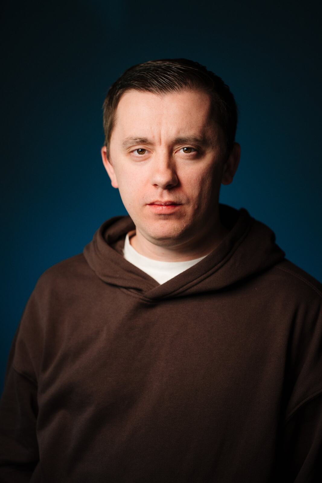 CATO Redux actor headshot on blue, photograph 21