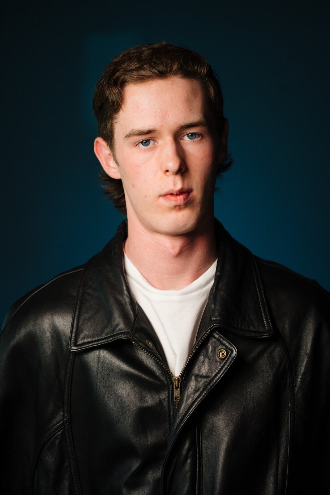 CATO Redux actor headshot on blue, photograph 26