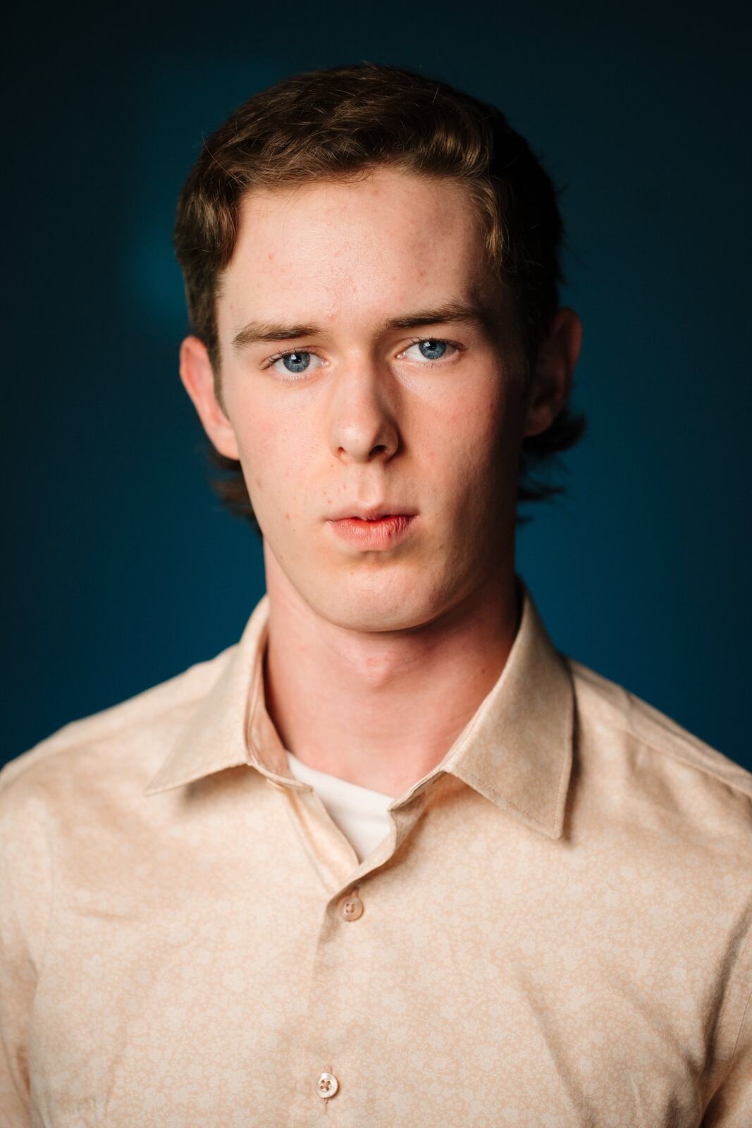 CATO Redux actor headshot on blue, photograph 29