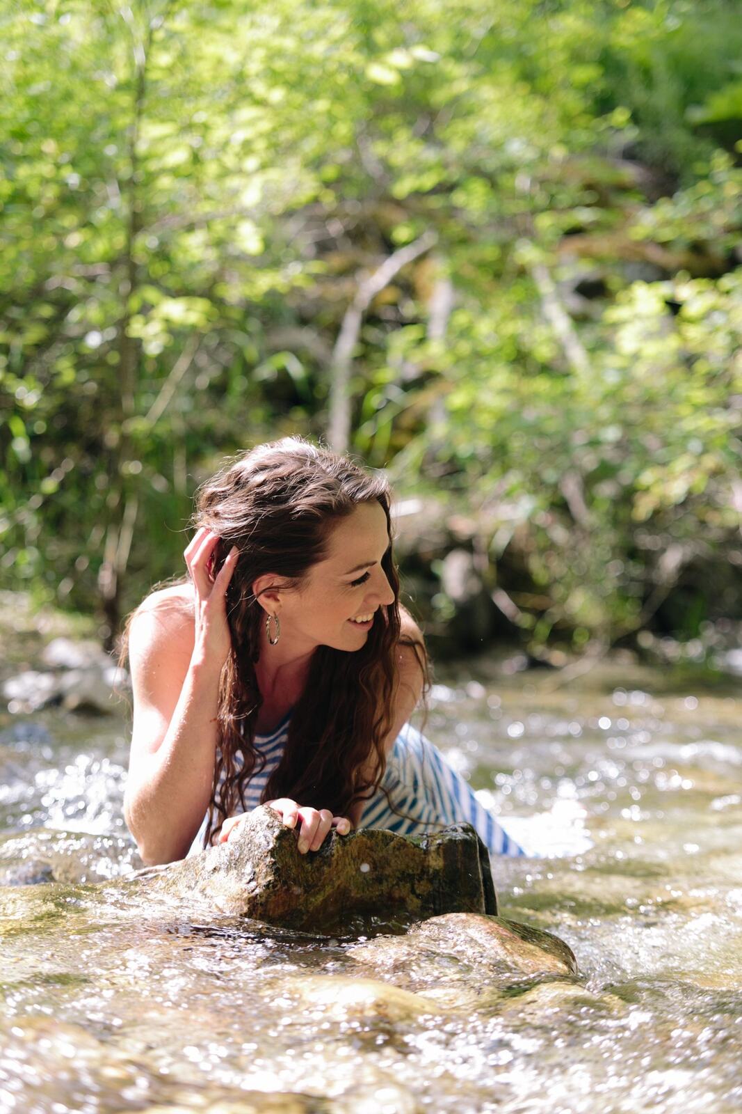 Charlotte, Rock the Dress portraits story frame 17: Charlotte Smith photographed for Rock the Dress near Salmon Arm, moving from blossoms and a yellow dress into creek, forest and horse portraits for the Canadian Cancer Society fundraiser.