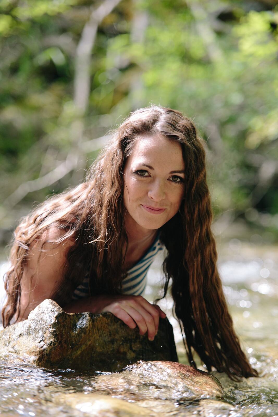 Charlotte, Rock the Dress portraits story frame 18: Charlotte Smith photographed for Rock the Dress near Salmon Arm, moving from blossoms and a yellow dress into creek, forest and horse portraits for the Canadian Cancer Society fundraiser.