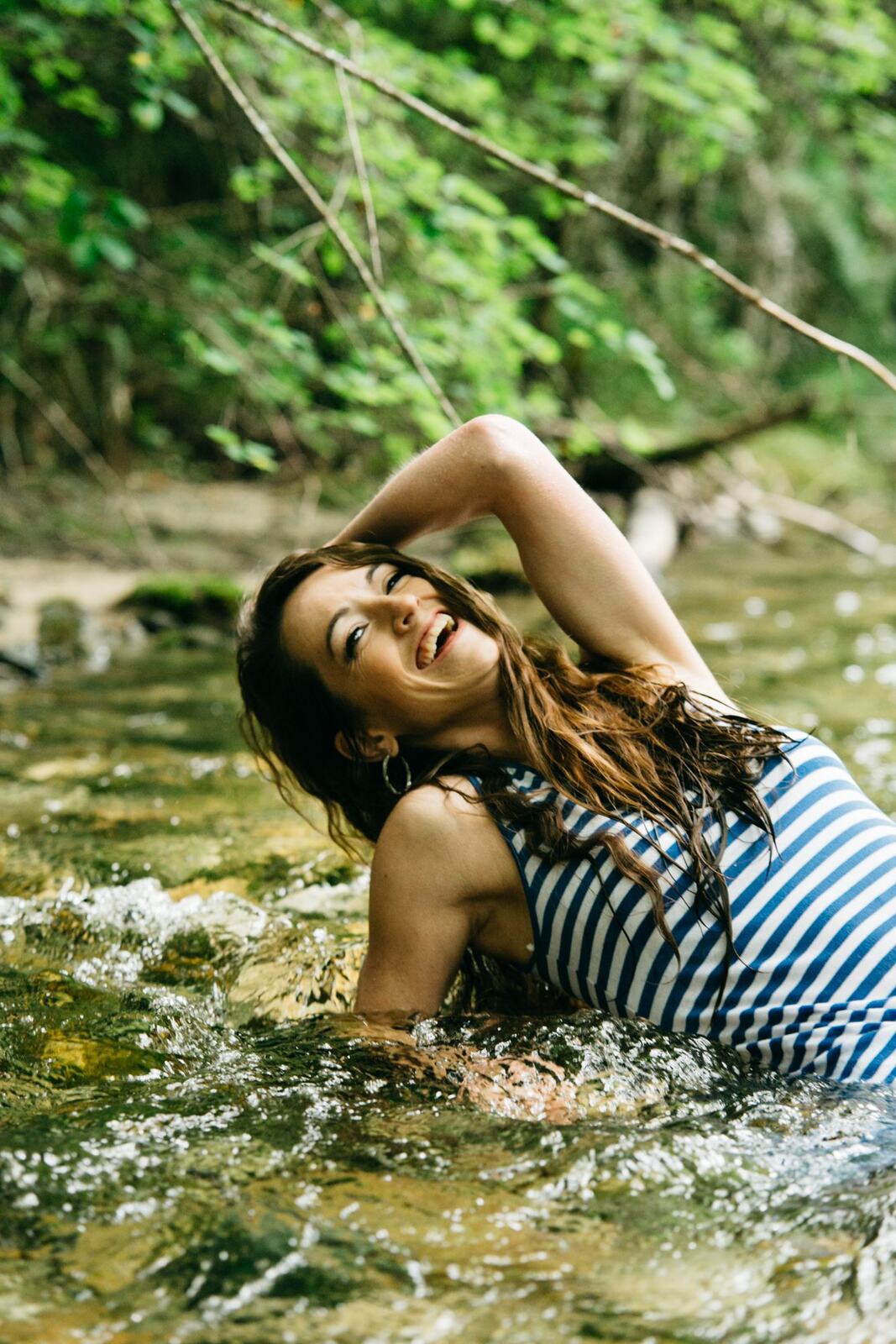 Charlotte, Rock the Dress portraits story frame 24: Charlotte Smith photographed for Rock the Dress near Salmon Arm, moving from blossoms and a yellow dress into creek, forest and horse portraits for the Canadian Cancer Society fundraiser.
