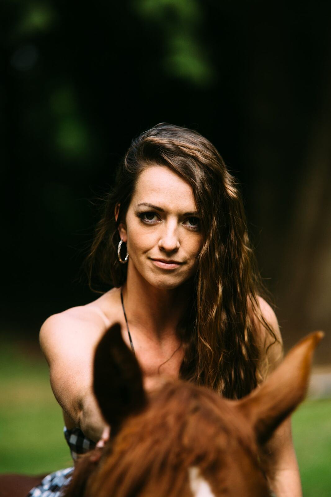 Charlotte, Rock the Dress portraits story frame 34: Charlotte Smith photographed for Rock the Dress near Salmon Arm, moving from blossoms and a yellow dress into creek, forest and horse portraits for the Canadian Cancer Society fundraiser.