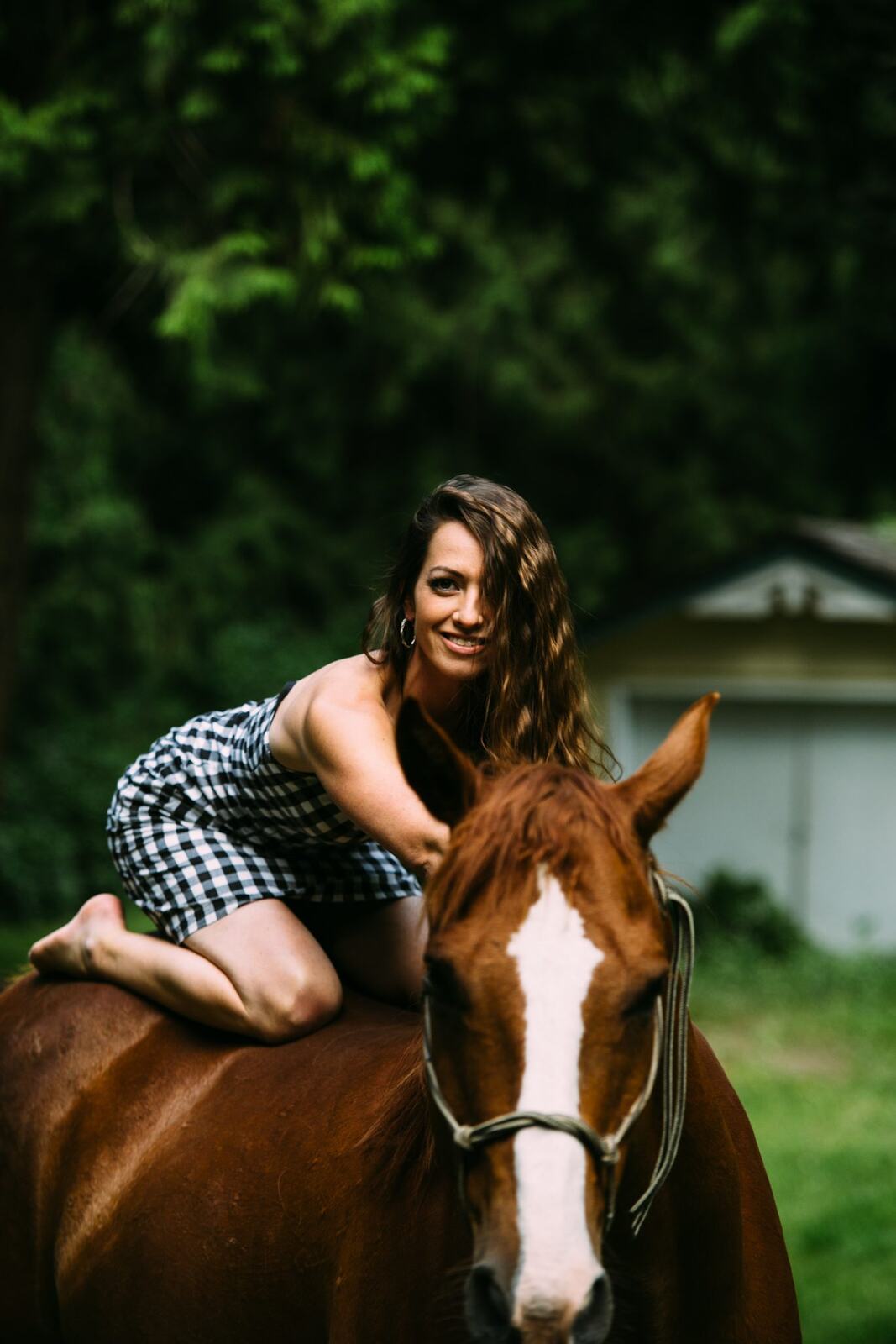 Charlotte, Rock the Dress portraits story frame 35: Charlotte Smith photographed for Rock the Dress near Salmon Arm, moving from blossoms and a yellow dress into creek, forest and horse portraits for the Canadian Cancer Society fundraiser.