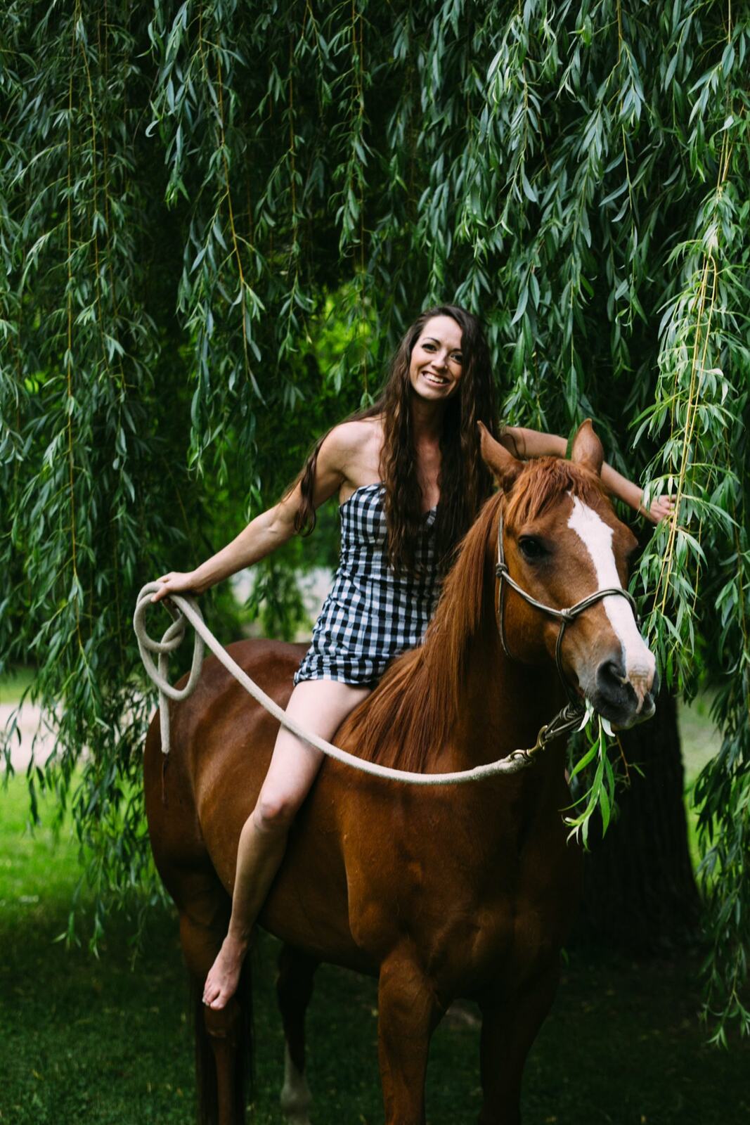 Charlotte, Rock the Dress portraits story frame 40: Charlotte Smith photographed for Rock the Dress near Salmon Arm, moving from blossoms and a yellow dress into creek, forest and horse portraits for the Canadian Cancer Society fundraiser.