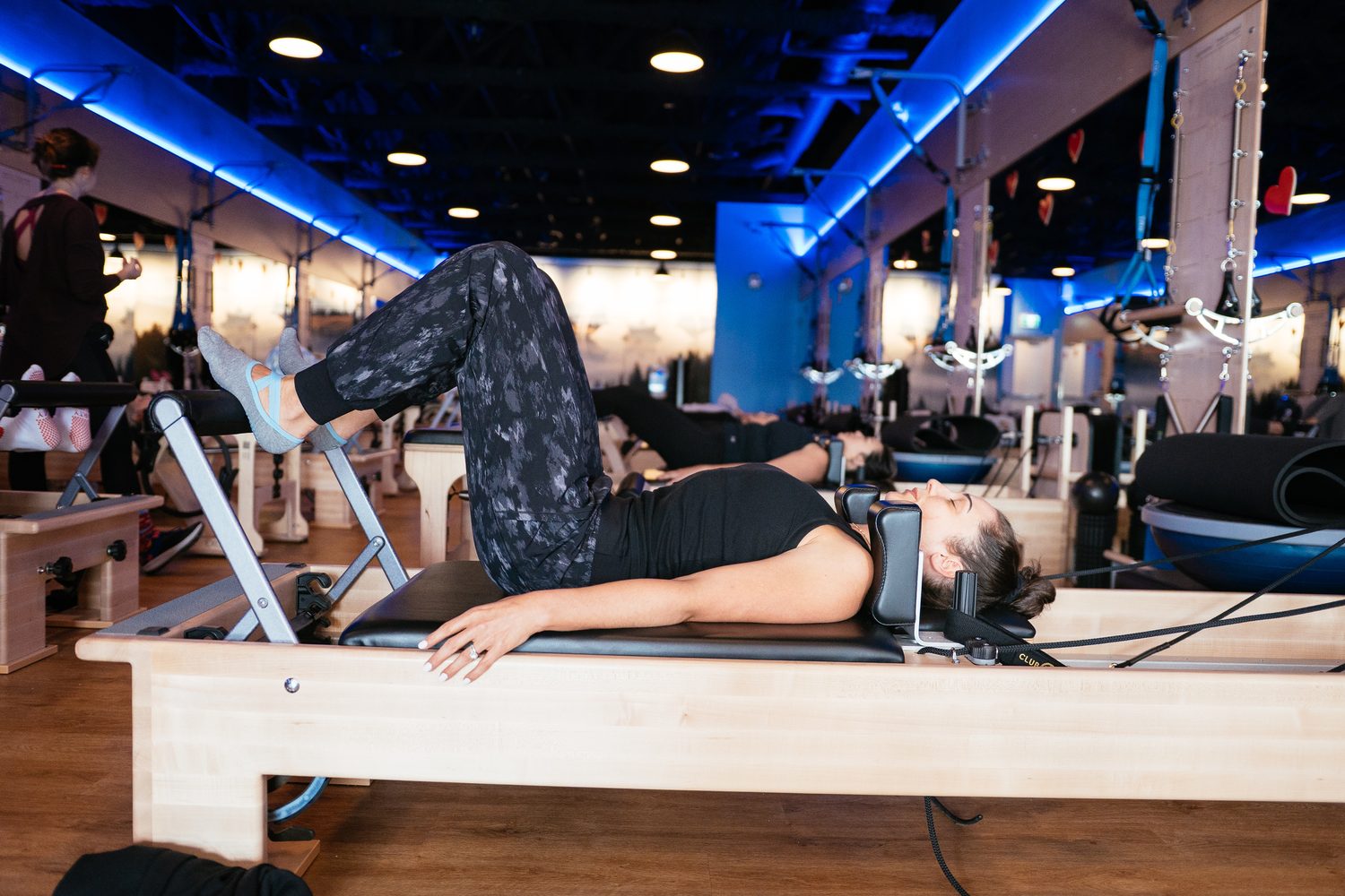 Club Pilates Barrhaven corporate story frame 25: Brand photography for Club Pilates Barrhaven in the Ottawa area, with studio interiors, staff portraits, private training rooms, equipment details and class movement for local marketing..