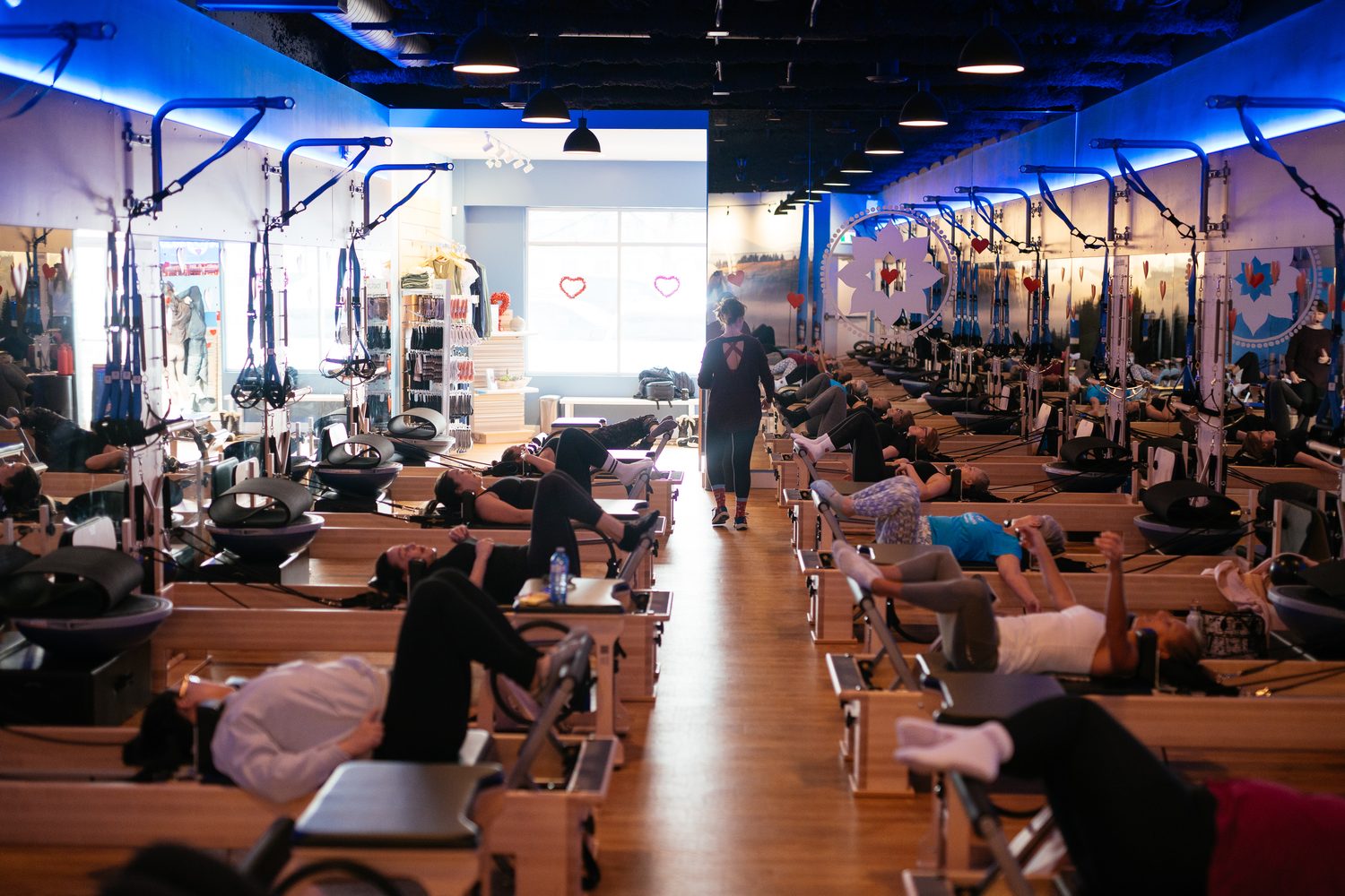 Club Pilates Barrhaven corporate story frame 30: Brand photography for Club Pilates Barrhaven in the Ottawa area, with studio interiors, staff portraits, private training rooms, equipment details and class movement for local marketing..