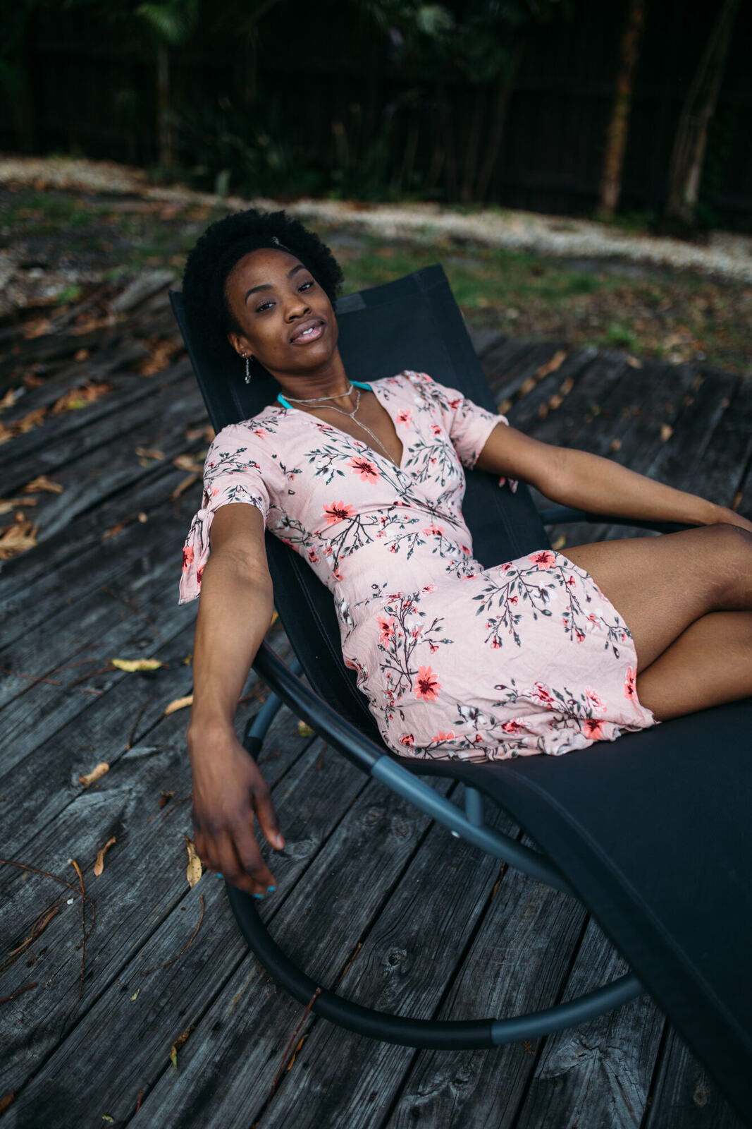 Dee-J in Miami portraits story frame 10: Two days with Dee-J in Miami, moving from a bright poolside portrait story to a second pool sequence and green-dress portraits along the riverbank.