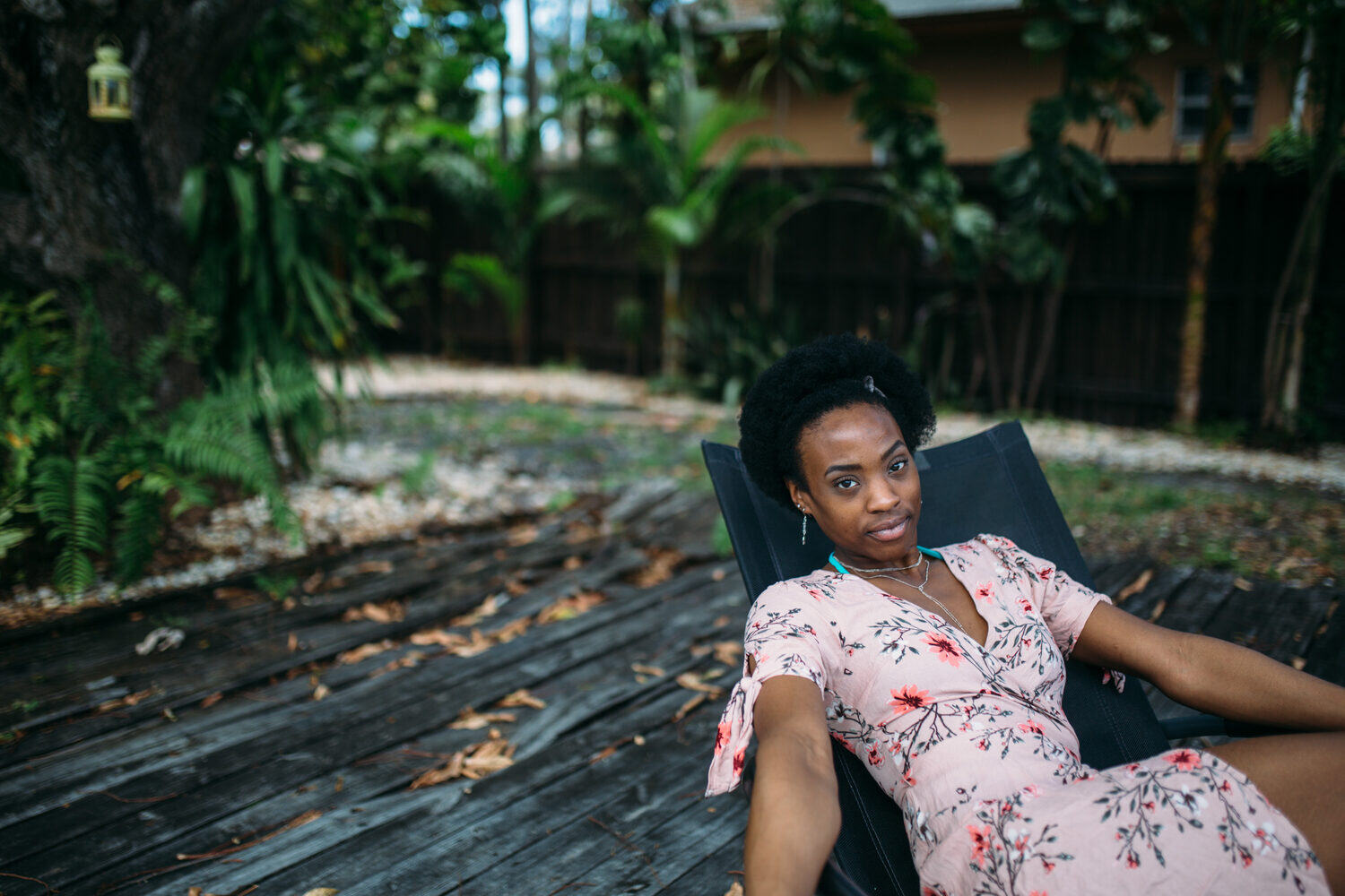 Dee-J in Miami portraits story frame 11: Two days with Dee-J in Miami, moving from a bright poolside portrait story to a second pool sequence and green-dress portraits along the riverbank.