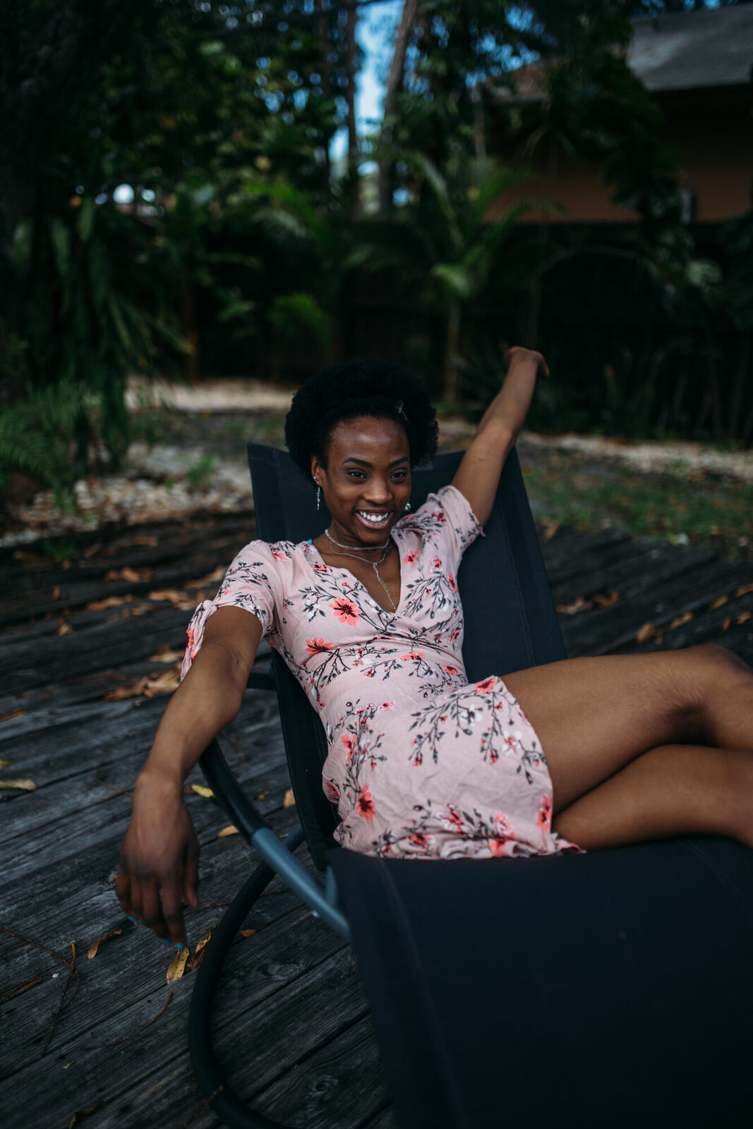 Dee-J in Miami portraits story frame 13: Two days with Dee-J in Miami, moving from a bright poolside portrait story to a second pool sequence and green-dress portraits along the riverbank.