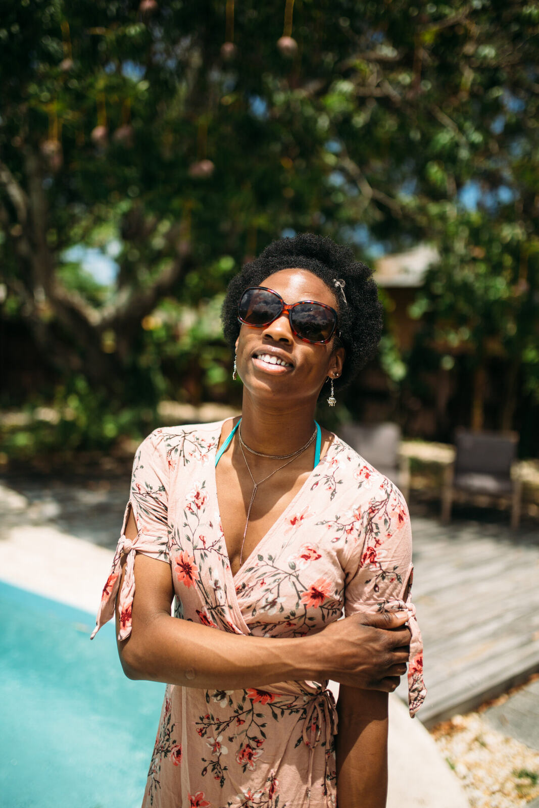 Dee-J in Miami portraits story frame 22: Two days with Dee-J in Miami, moving from a bright poolside portrait story to a second pool sequence and green-dress portraits along the riverbank.
