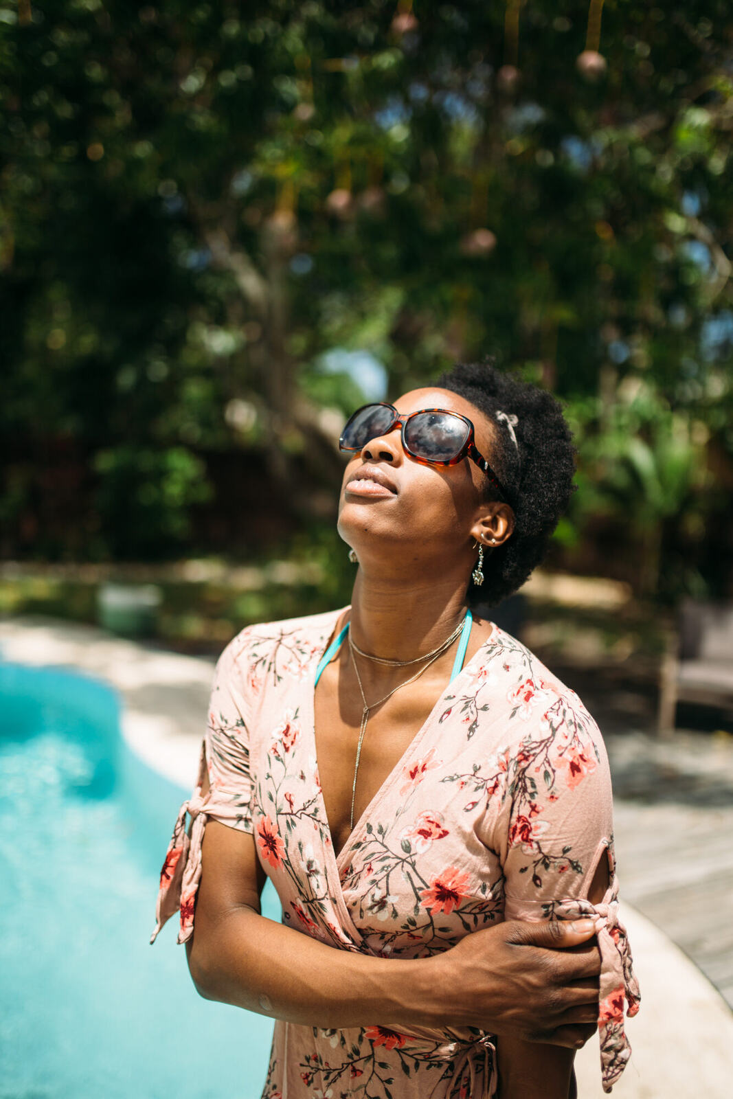 Dee-J in Miami portraits story frame 23: Two days with Dee-J in Miami, moving from a bright poolside portrait story to a second pool sequence and green-dress portraits along the riverbank.