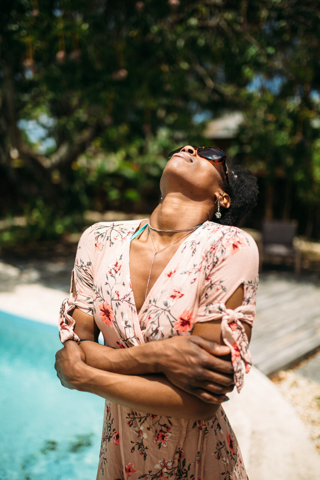 Dee-J in Miami portraits story frame 24: Two days with Dee-J in Miami, moving from a bright poolside portrait story to a second pool sequence and green-dress portraits along the riverbank.