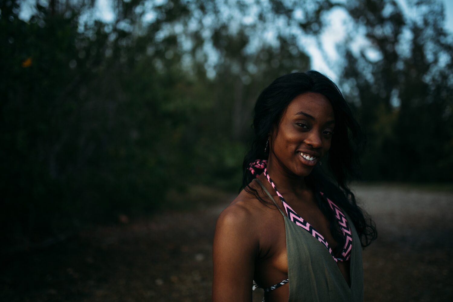 Dee-J in Miami portraits story frame 36: Two days with Dee-J in Miami, moving from a bright poolside portrait story to a second pool sequence and green-dress portraits along the riverbank.
