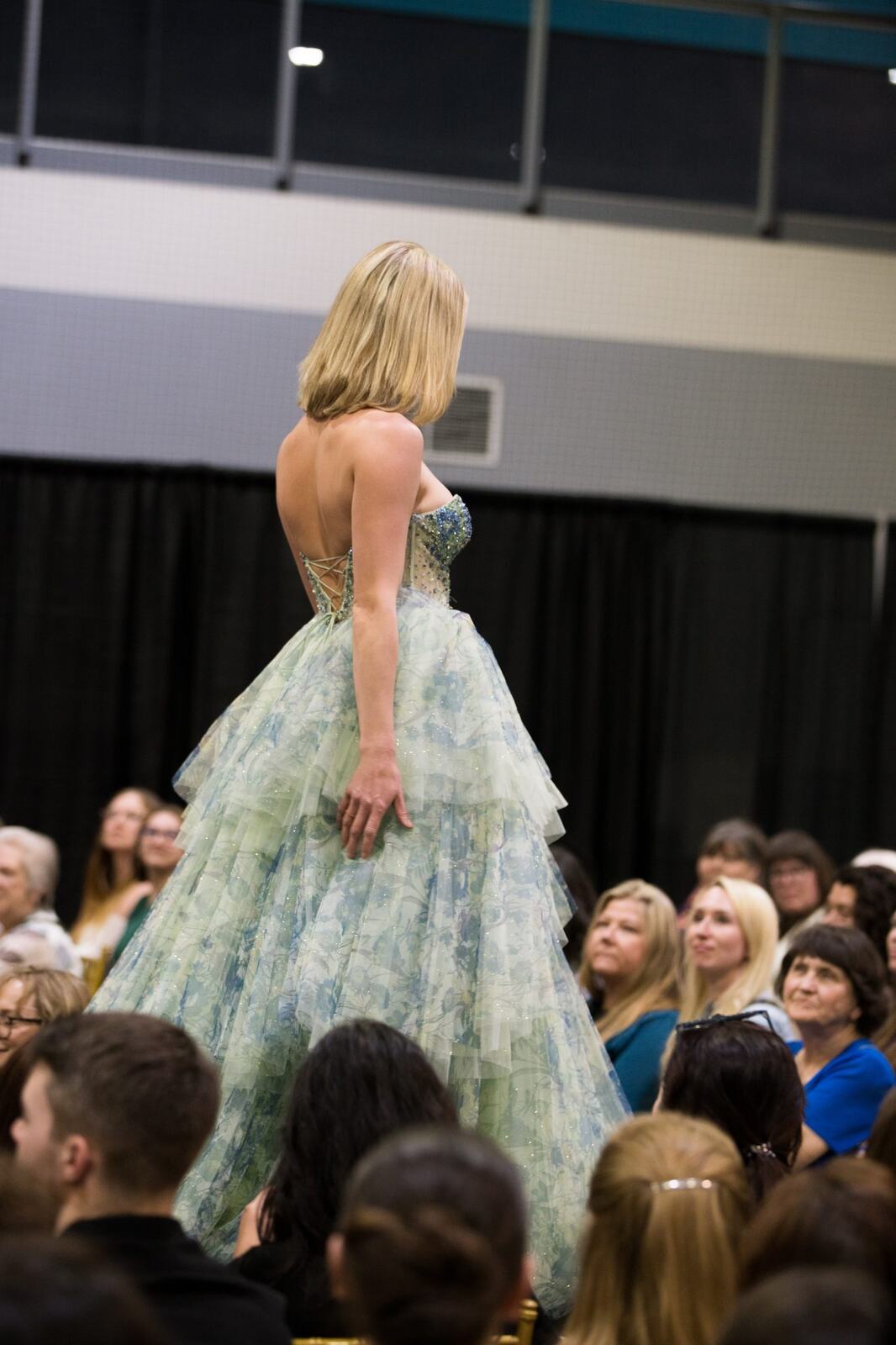 Diva Den at Kelowna Bridal Extravaganza corporate story frame 36: Runway and bridal beauty photography for Diva Den Day Spa at Kelowna Bridal Extravaganza, with women-focused looks from Sunny, Montana, Elena, Beth and Sky for Okanagan wedding and beauty brands..