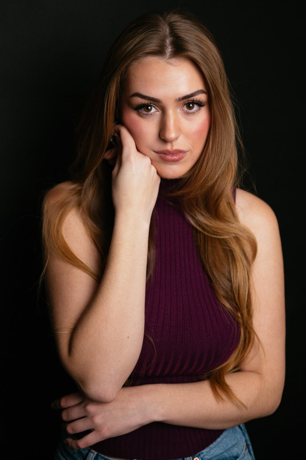 Bright studio headshot of Elena in wardrobe look 3