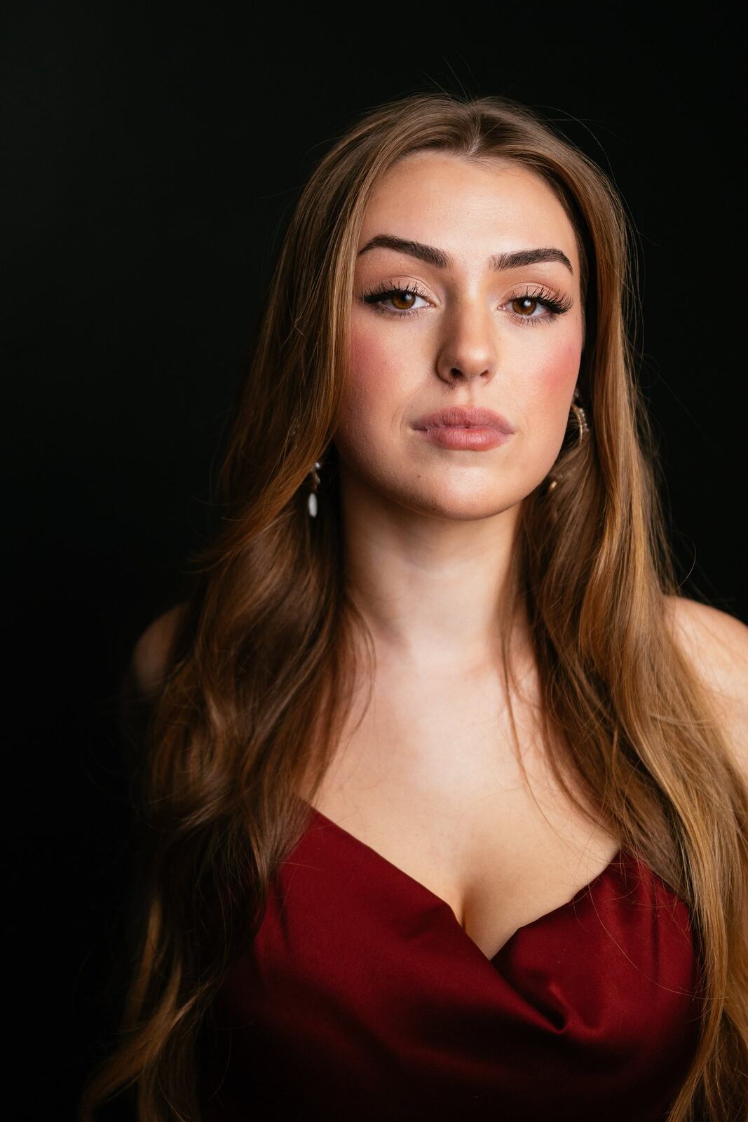 Bright studio headshot of Elena in wardrobe look 5