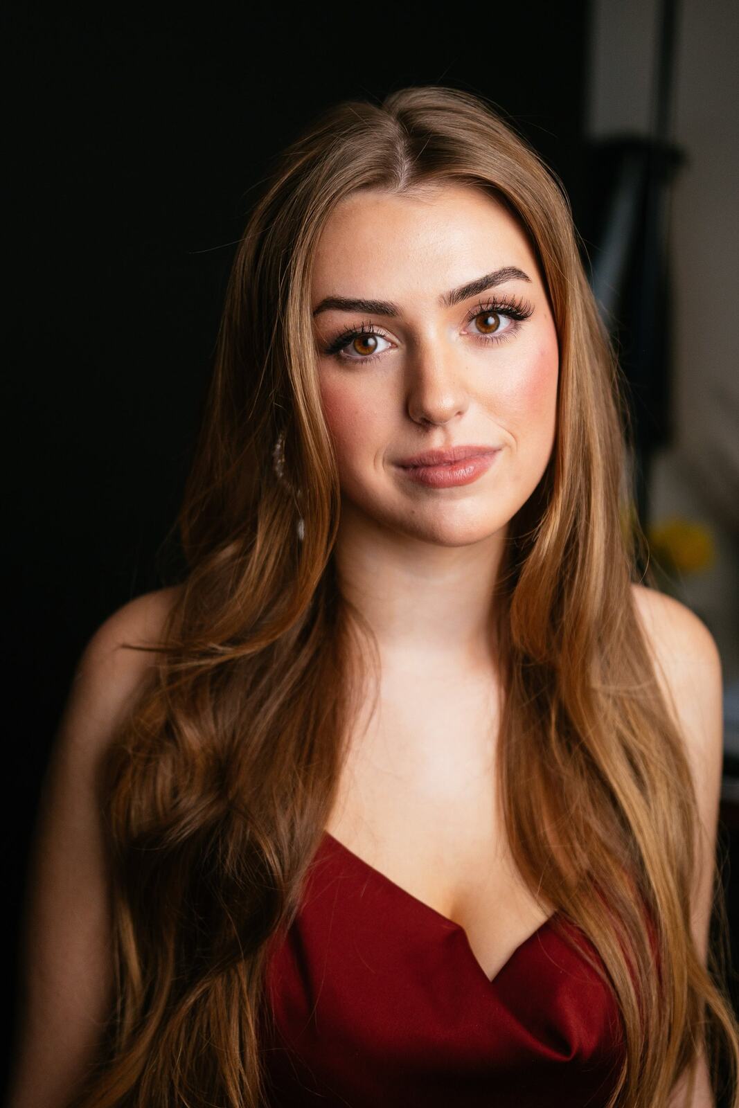 Bright studio headshot of Elena in wardrobe look 5