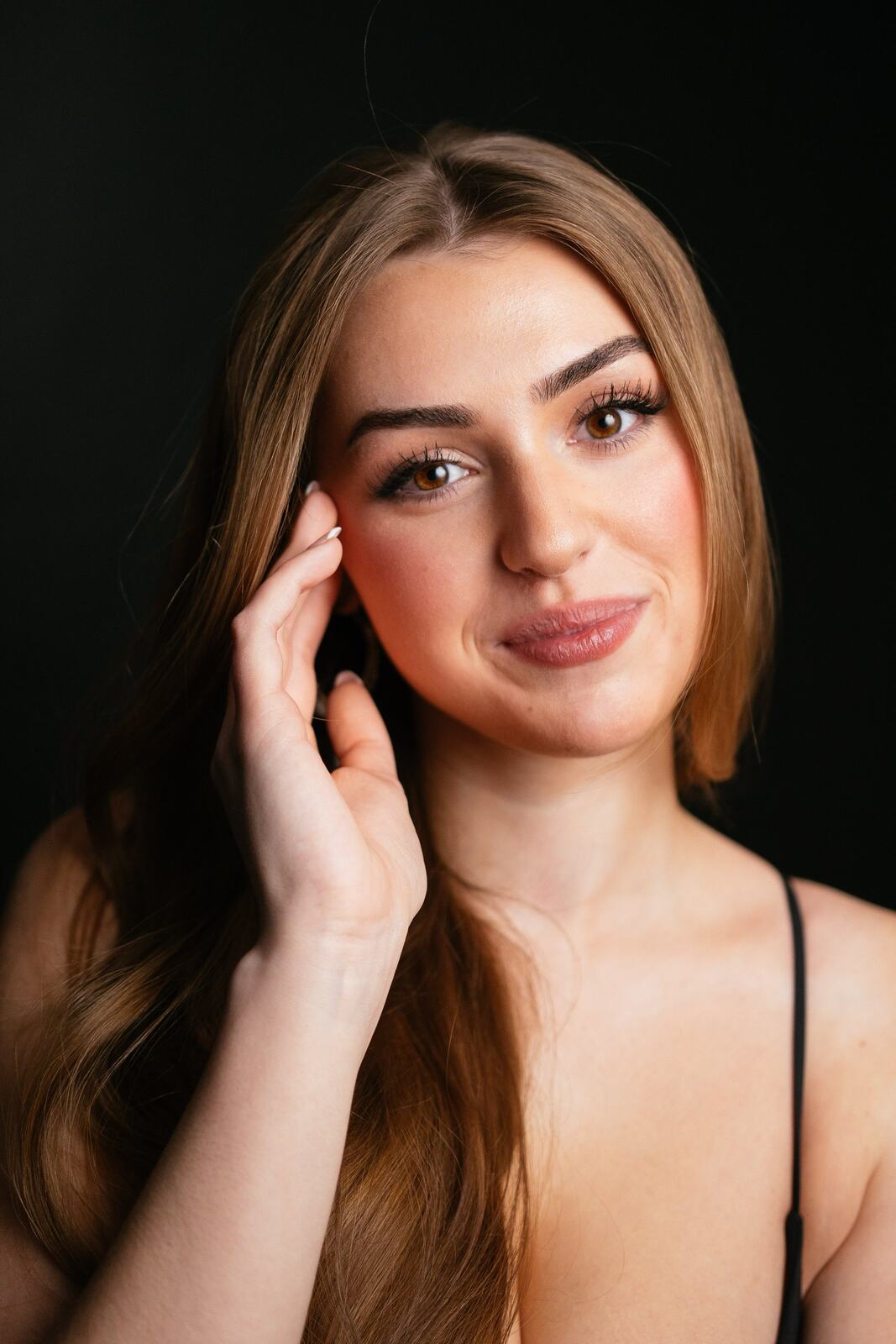 Bright studio headshot of Elena in wardrobe look 7