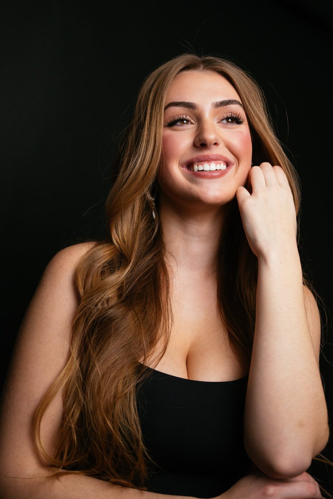 Bright studio headshot of Elena in wardrobe look 7