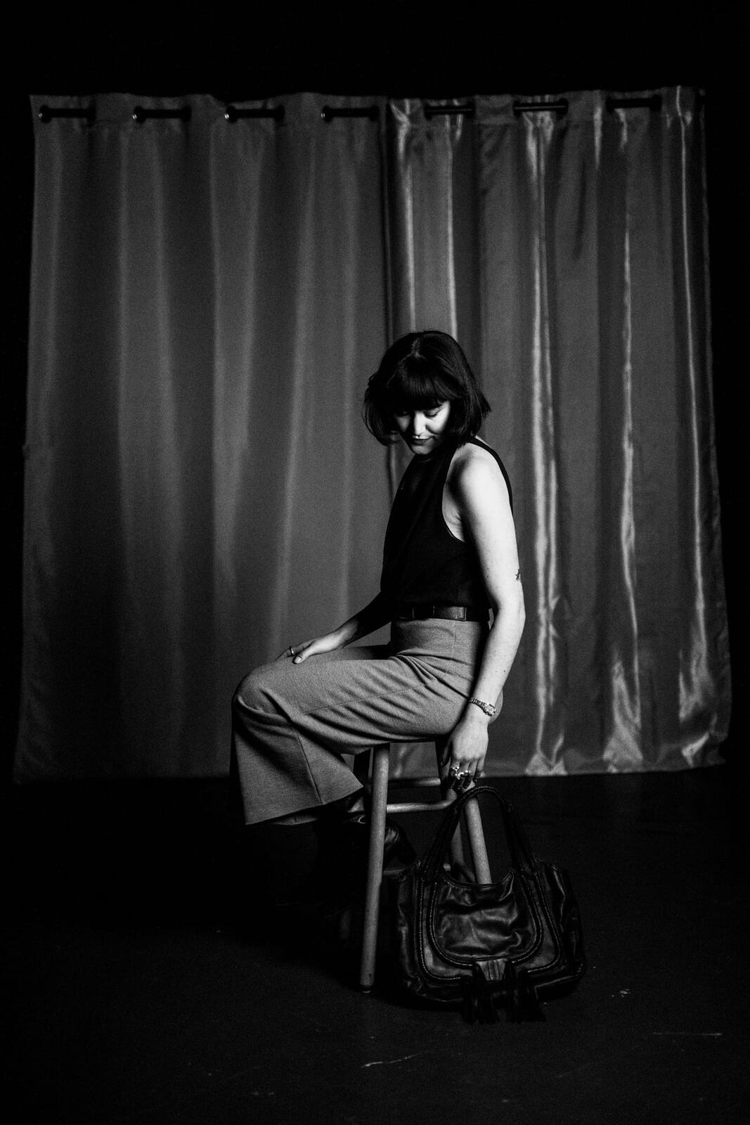 Emily in Blue portraits story frame 2: A studio portrait session with smoke, black backdrop, blue dress and a clean editorial studio mood.