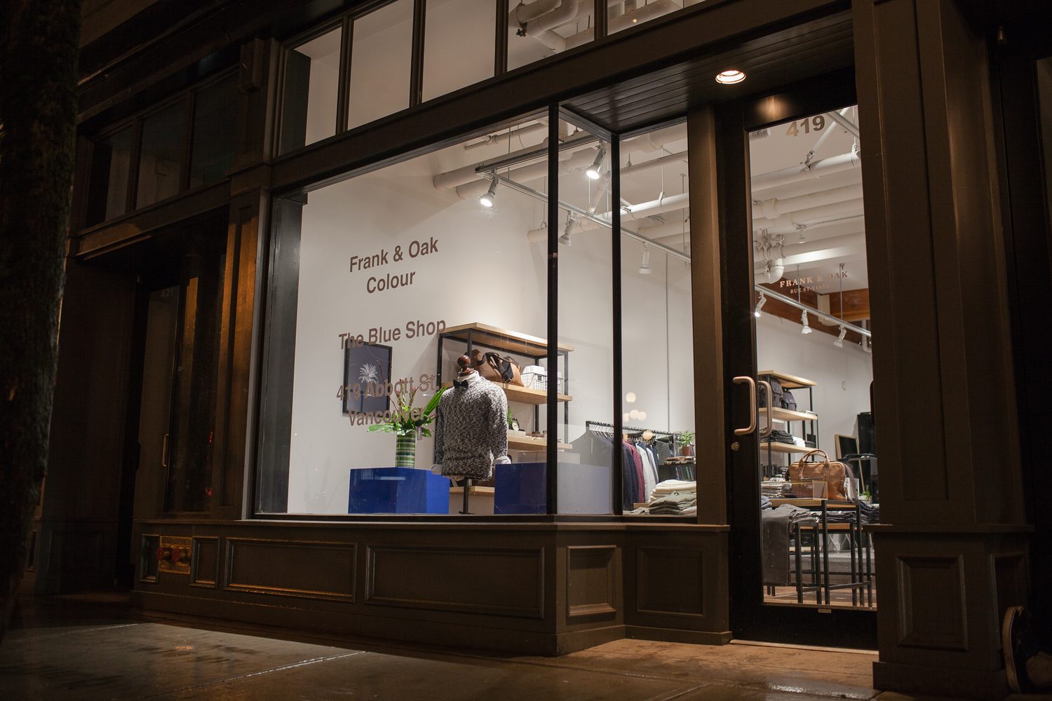 Frank & Oak Colour corporate story frame 1: Retail event photography for Frank & Oak Colour at The Blue Shop on Abbott Street in Vancouver, with the storefront, guests, clothing, details and the room in use.