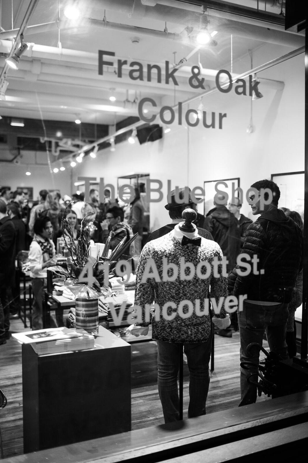 Frank & Oak Colour corporate story frame 25: Retail event photography for Frank & Oak Colour at The Blue Shop on Abbott Street in Vancouver, with the storefront, guests, clothing, details and the room in use.