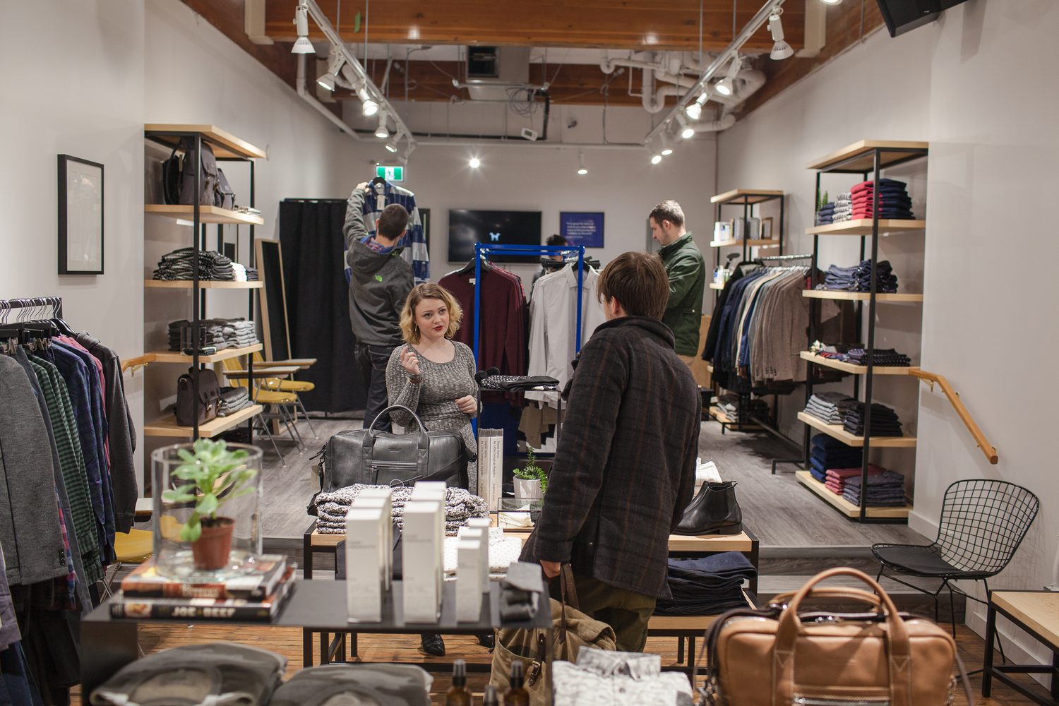 Frank & Oak Colour corporate story frame 2: Retail event photography for Frank & Oak Colour at The Blue Shop on Abbott Street in Vancouver, with the storefront, guests, clothing, details and the room in use.