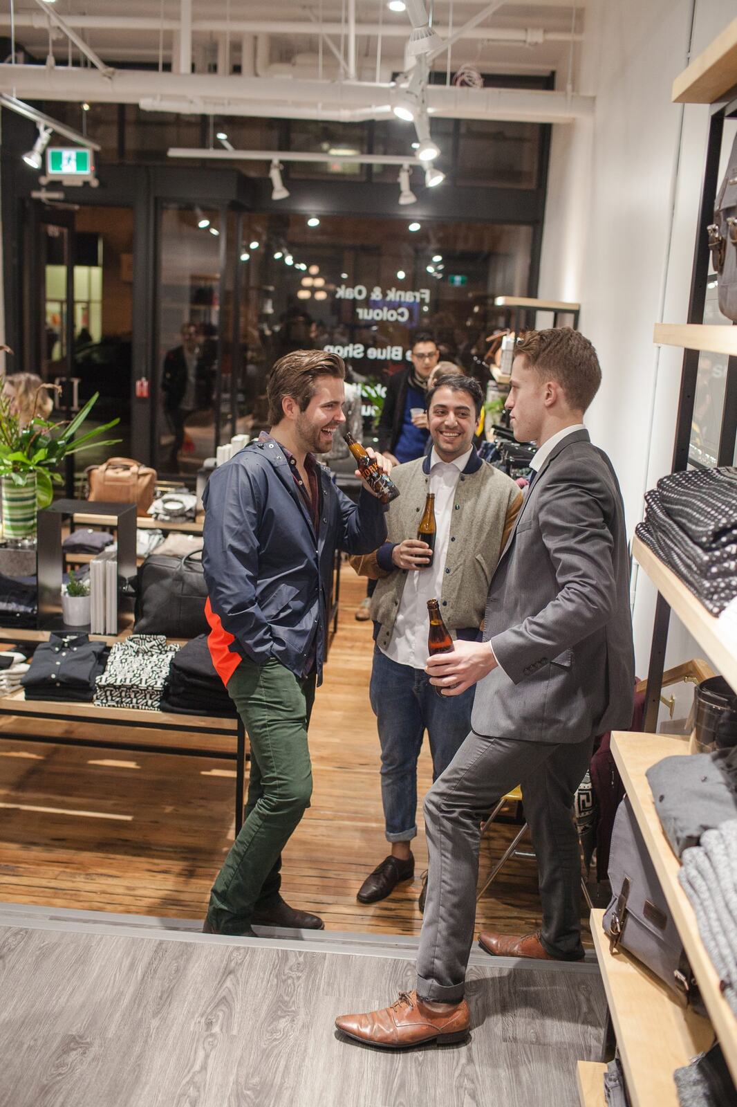 Frank & Oak Colour corporate story frame 28: Retail event photography for Frank & Oak Colour at The Blue Shop on Abbott Street in Vancouver, with the storefront, guests, clothing, details and the room in use.