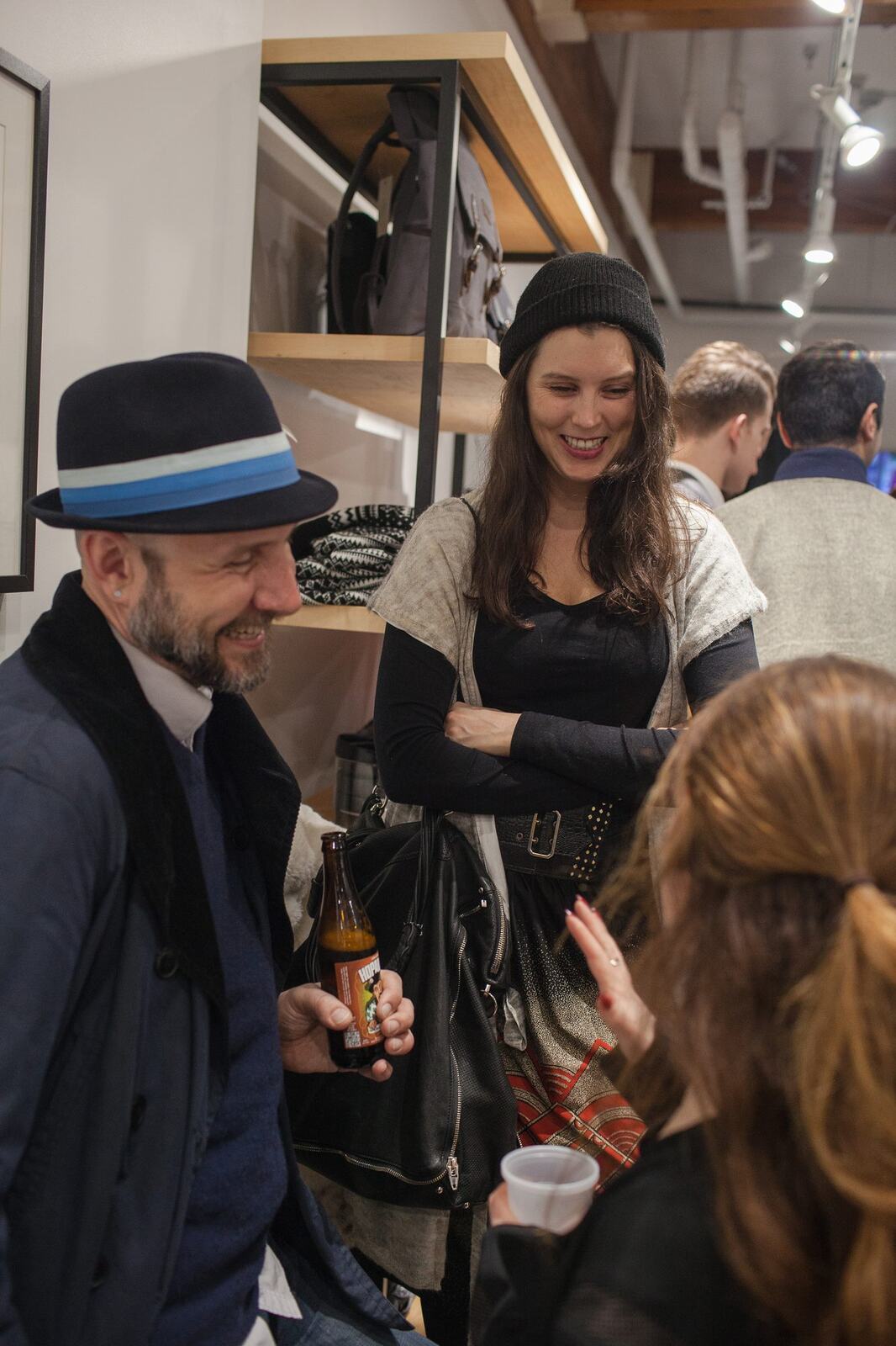 Frank & Oak Colour corporate story frame 26: Retail event photography for Frank & Oak Colour at The Blue Shop on Abbott Street in Vancouver, with the storefront, guests, clothing, details and the room in use.