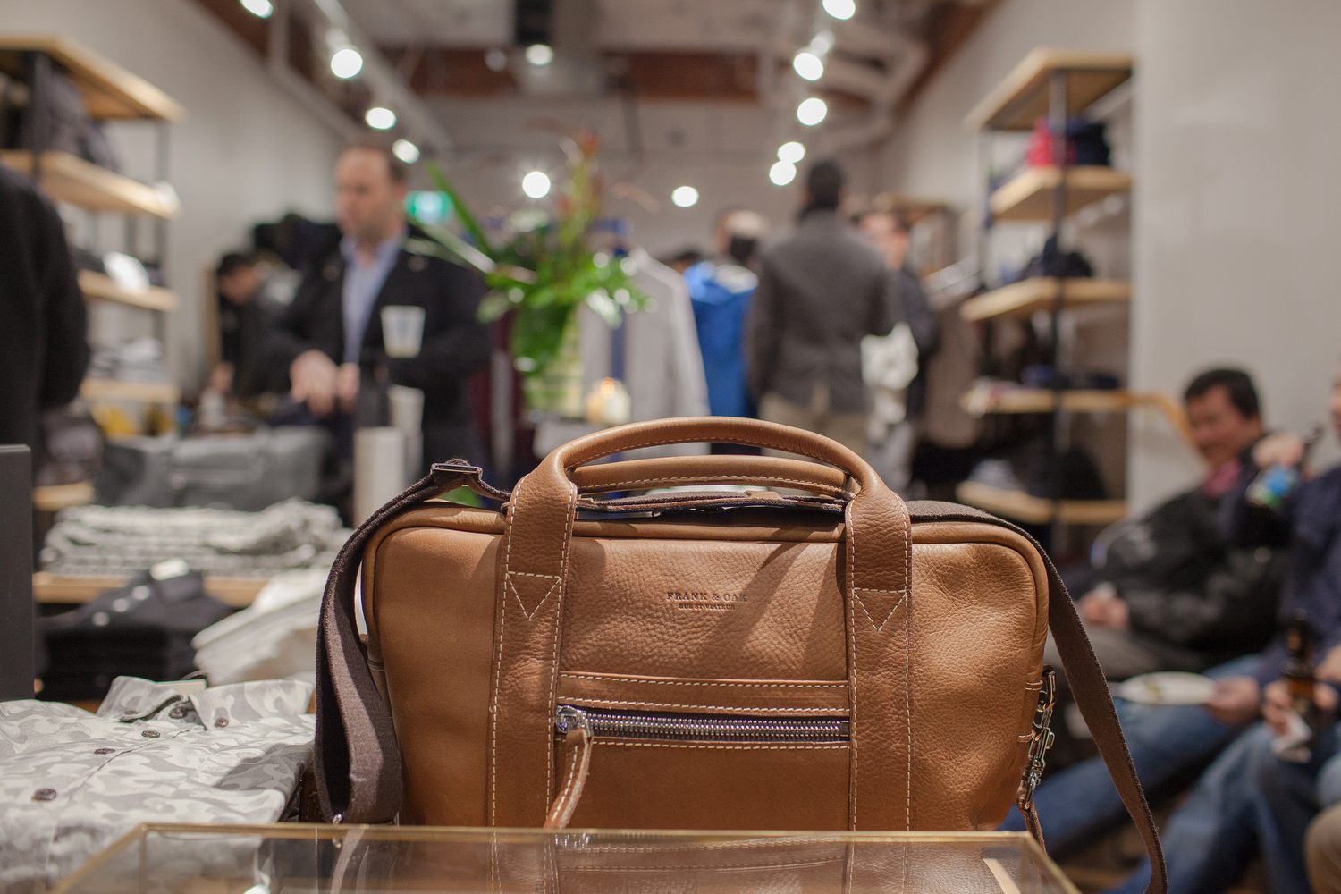 Frank & Oak Colour corporate story frame 20: Retail event photography for Frank & Oak Colour at The Blue Shop on Abbott Street in Vancouver, with the storefront, guests, clothing, details and the room in use.