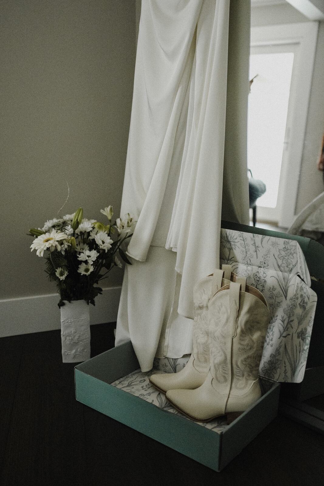 Giuliana and Olando weddings story frame 8: An outdoor wedding at Love Reins Ranch in Lake Country, with Upper Mission getting-ready moments, horses nearby, and Italian and Jamaican family texture..