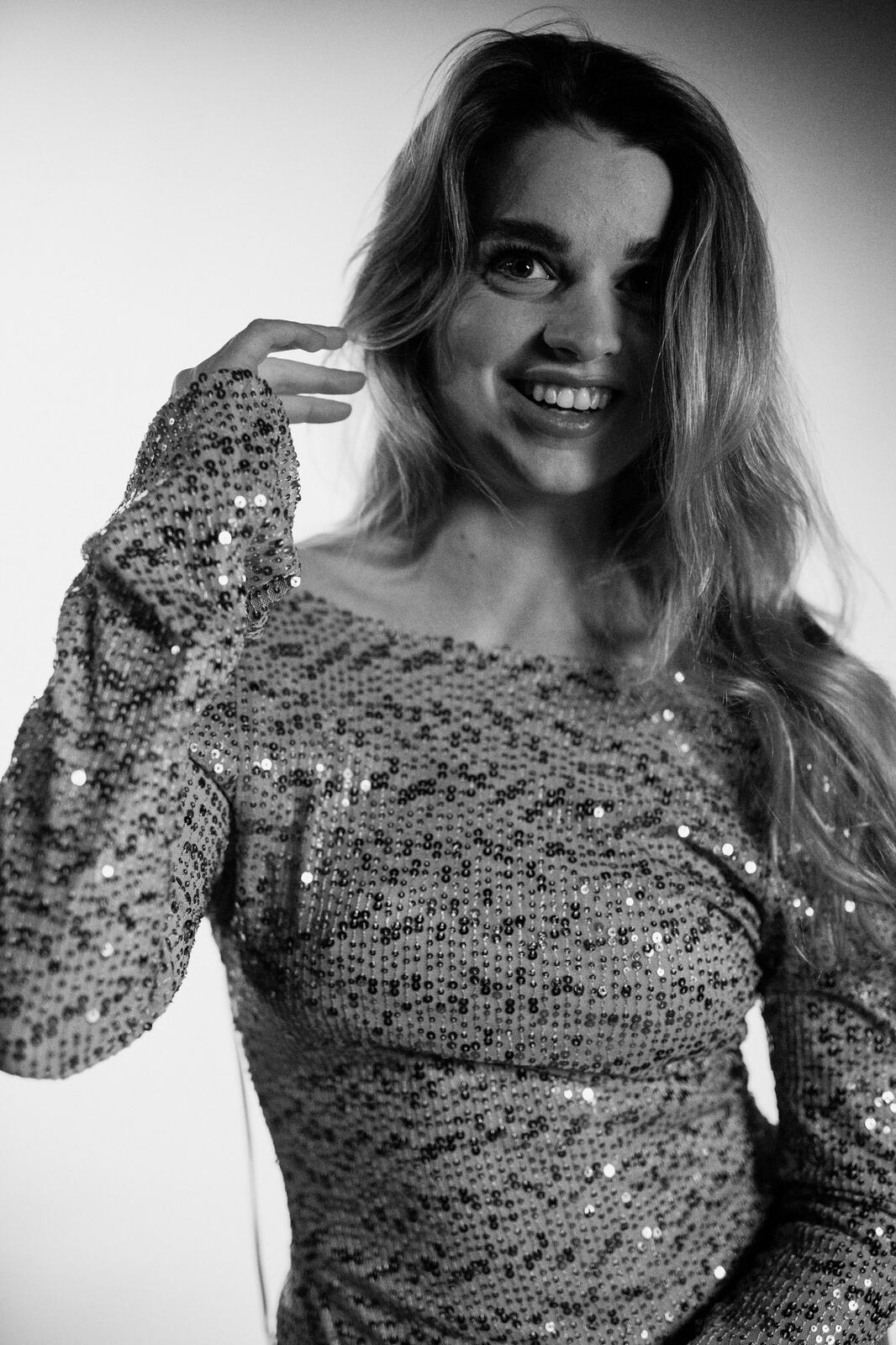 Hannah K in Black and White portraits story frame 36: A black-and-white studio portrait study with clean wardrobe shifts, close face work and controlled light.