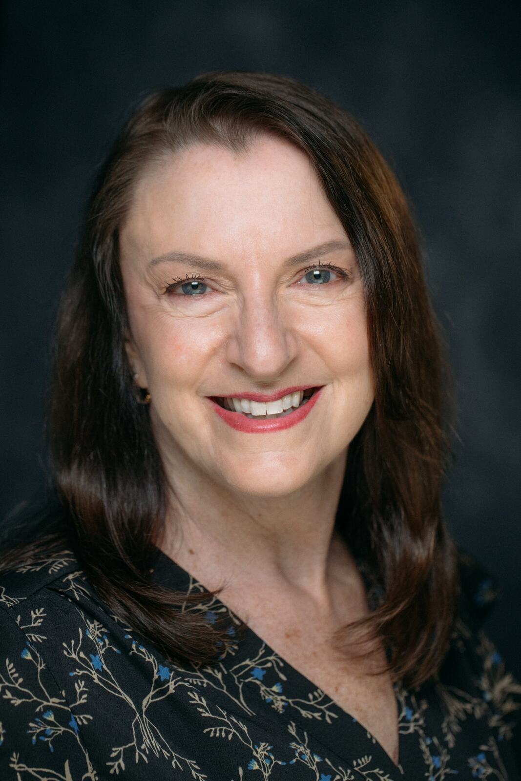 Marie smiling in a finished Headshot Day portrait