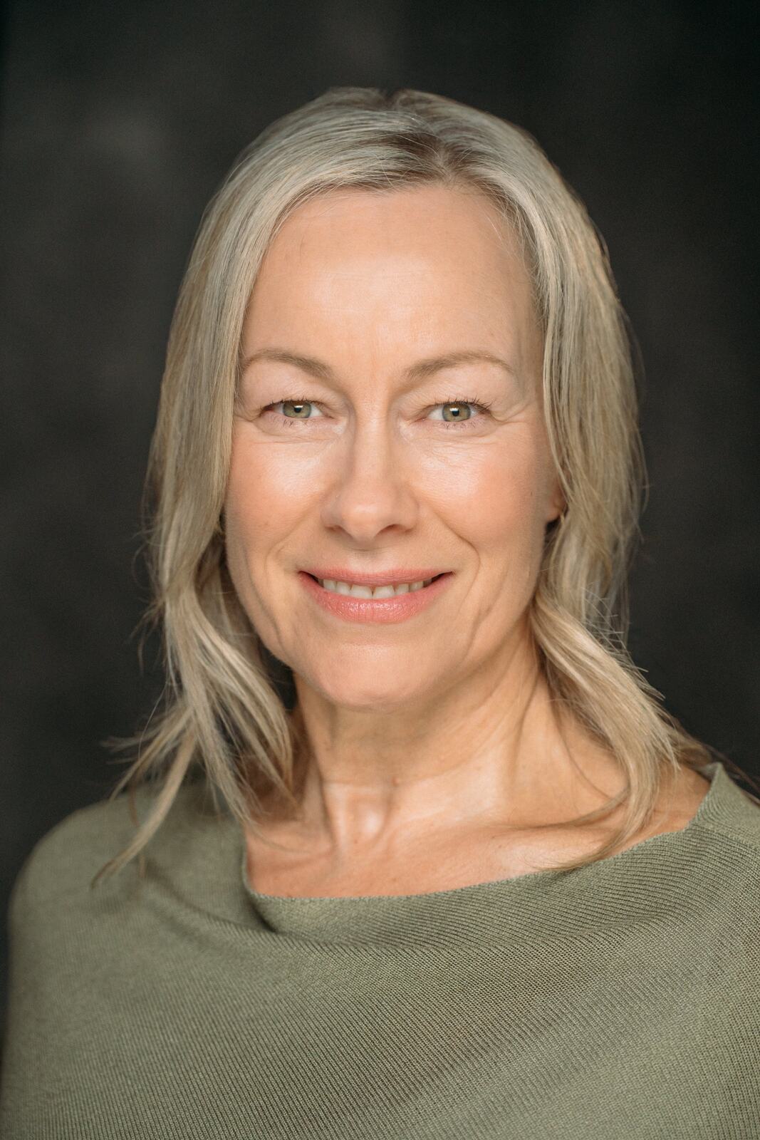 Shaye in a soft green top for a natural headshot
