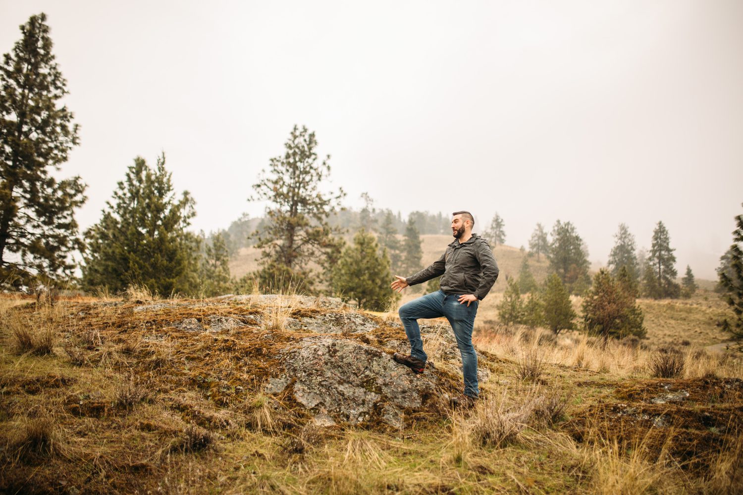 Jeremy standing in warm hillside light in a dark blazer for Optimize Organics.