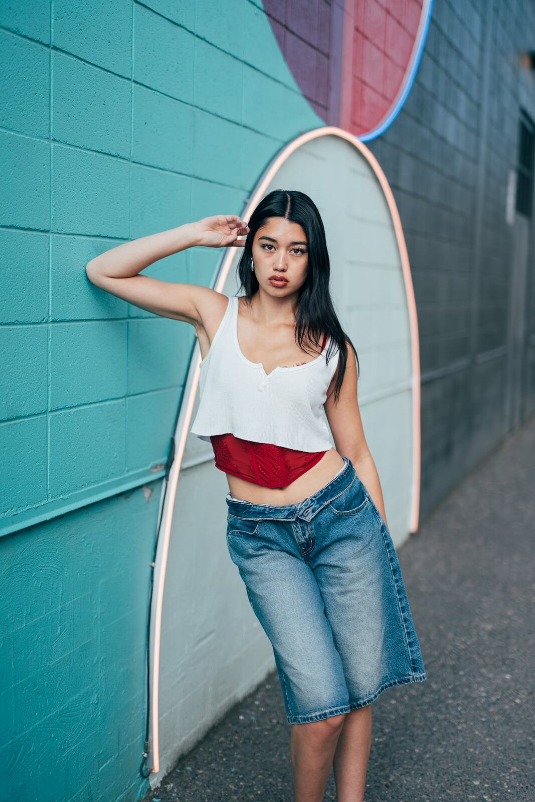 Julia in Kamloops portraits story frame 6: Colour walls, graffiti, black brick, red brick and a city walk with enough range to feel like a little editorial day.