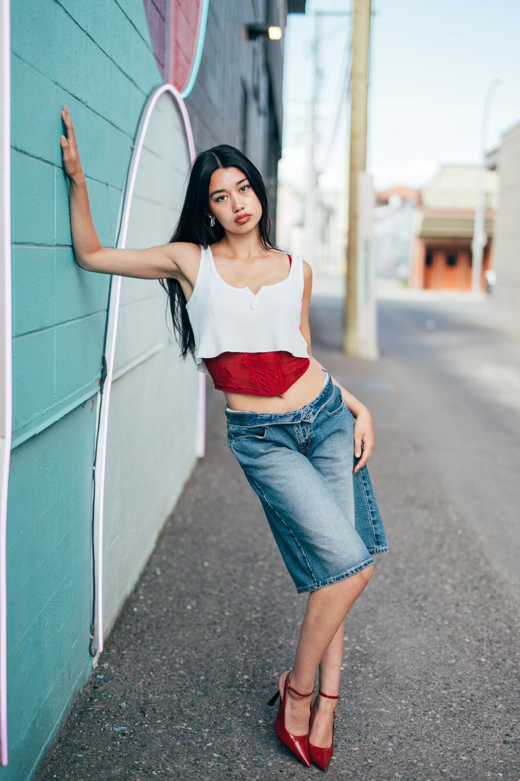 Julia in Kamloops portraits story frame 13: Colour walls, graffiti, black brick, red brick and a city walk with enough range to feel like a little editorial day.