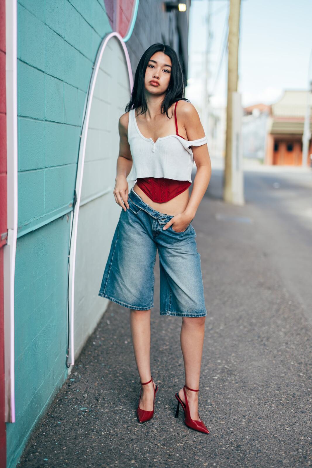 Julia in Kamloops portraits story frame 16: Colour walls, graffiti, black brick, red brick and a city walk with enough range to feel like a little editorial day.