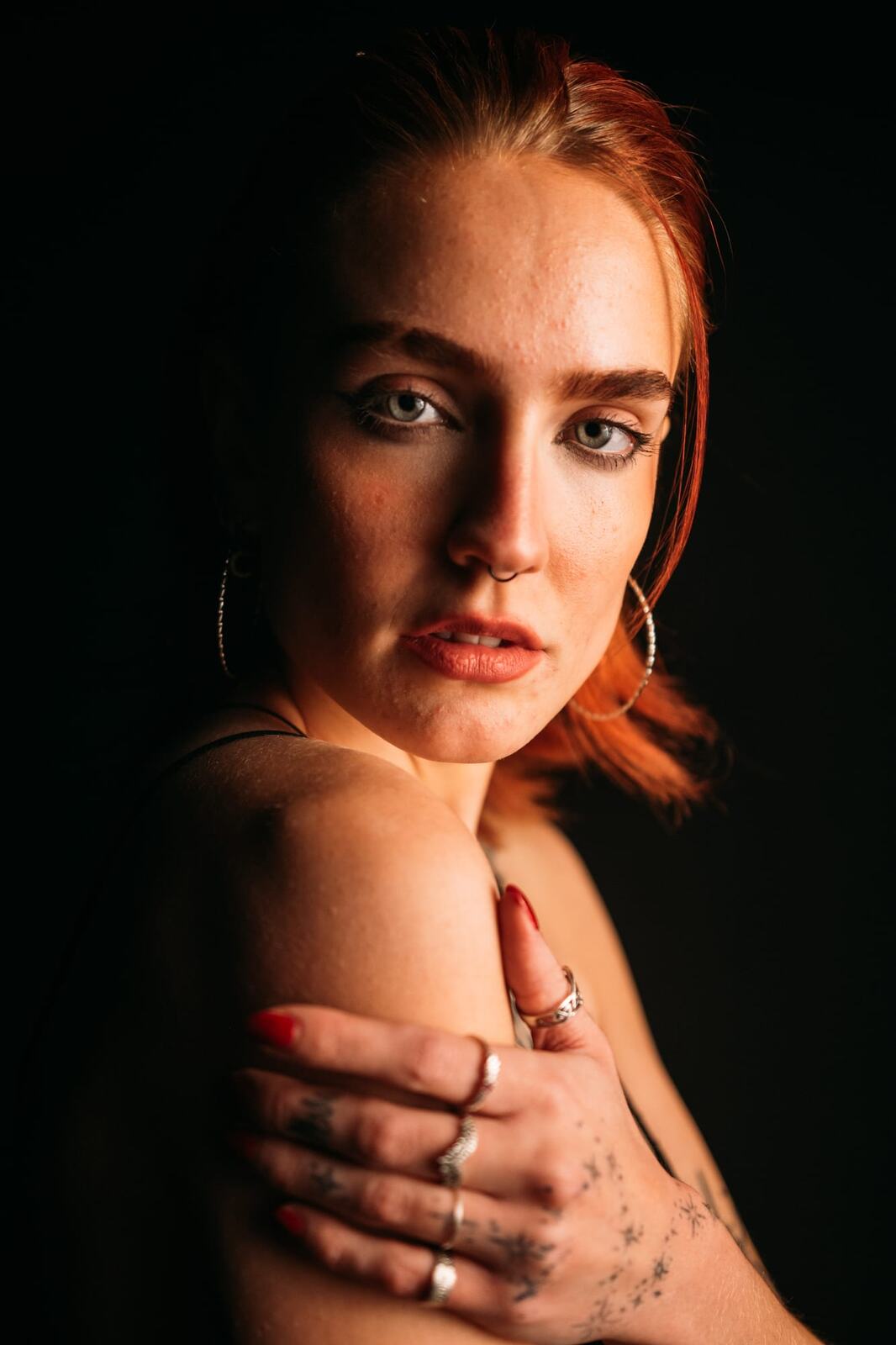 Katya portraits story frame 11: Katya in a studio portrait story with close expression, beauty direction, soft wardrobe detail and a quiet creative-portfolio mood.
