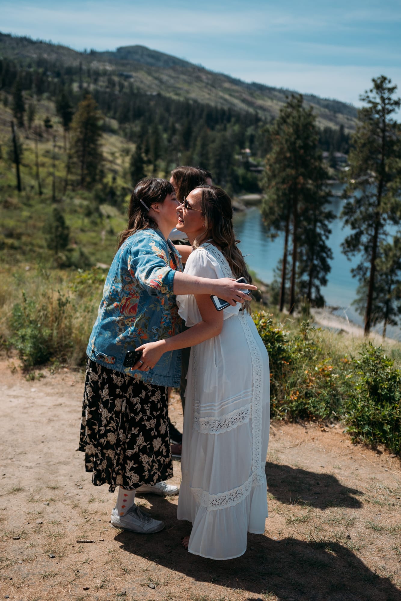 Kristina and Mark weddings story frame 3: A Bertram Creek wedding in South Kelowna with Okanagan Lake light, film-friend history, family texture and Lithuanian food and planning details..