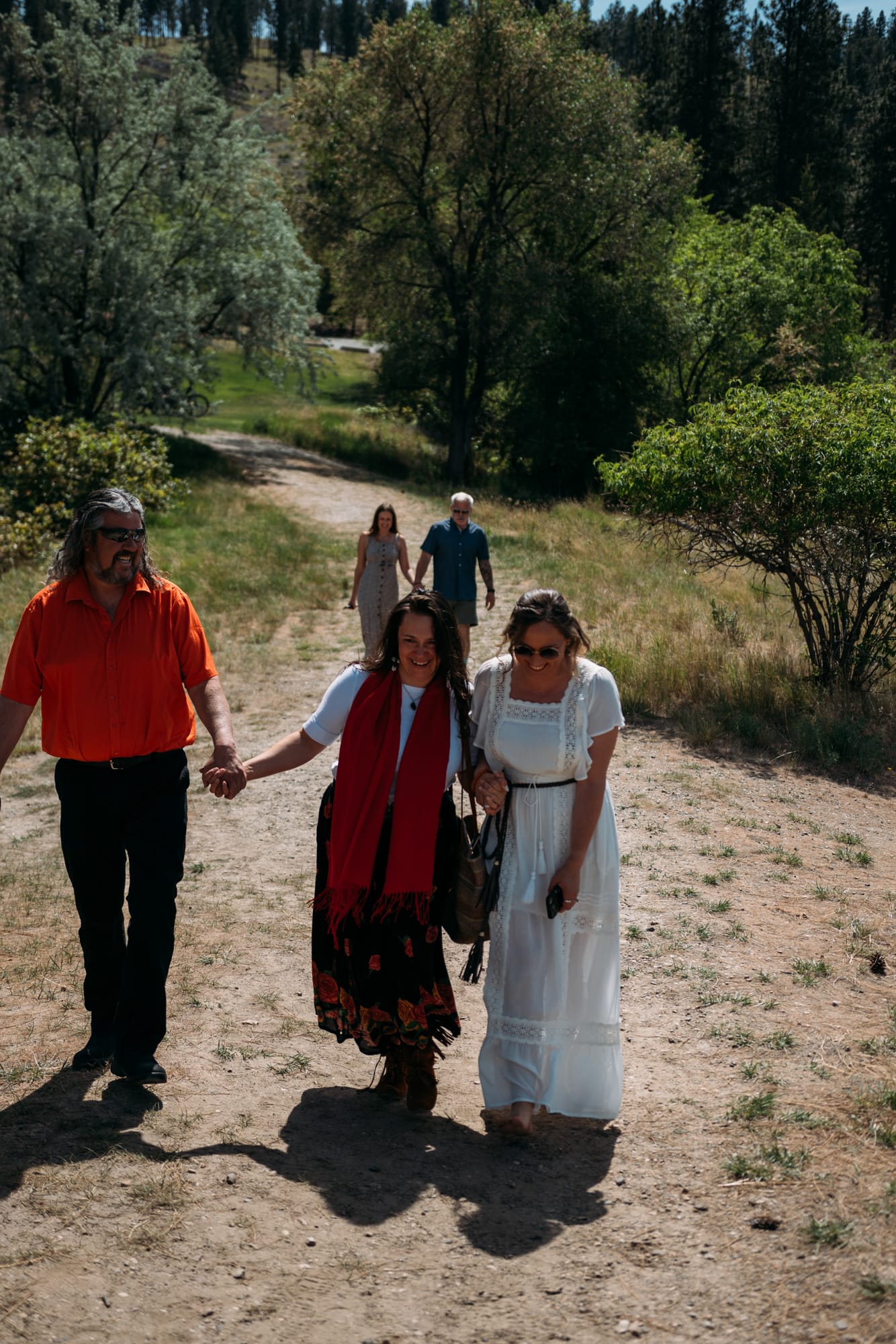 Kristina and Mark weddings story frame 4: A Bertram Creek wedding in South Kelowna with Okanagan Lake light, film-friend history, family texture and Lithuanian food and planning details..