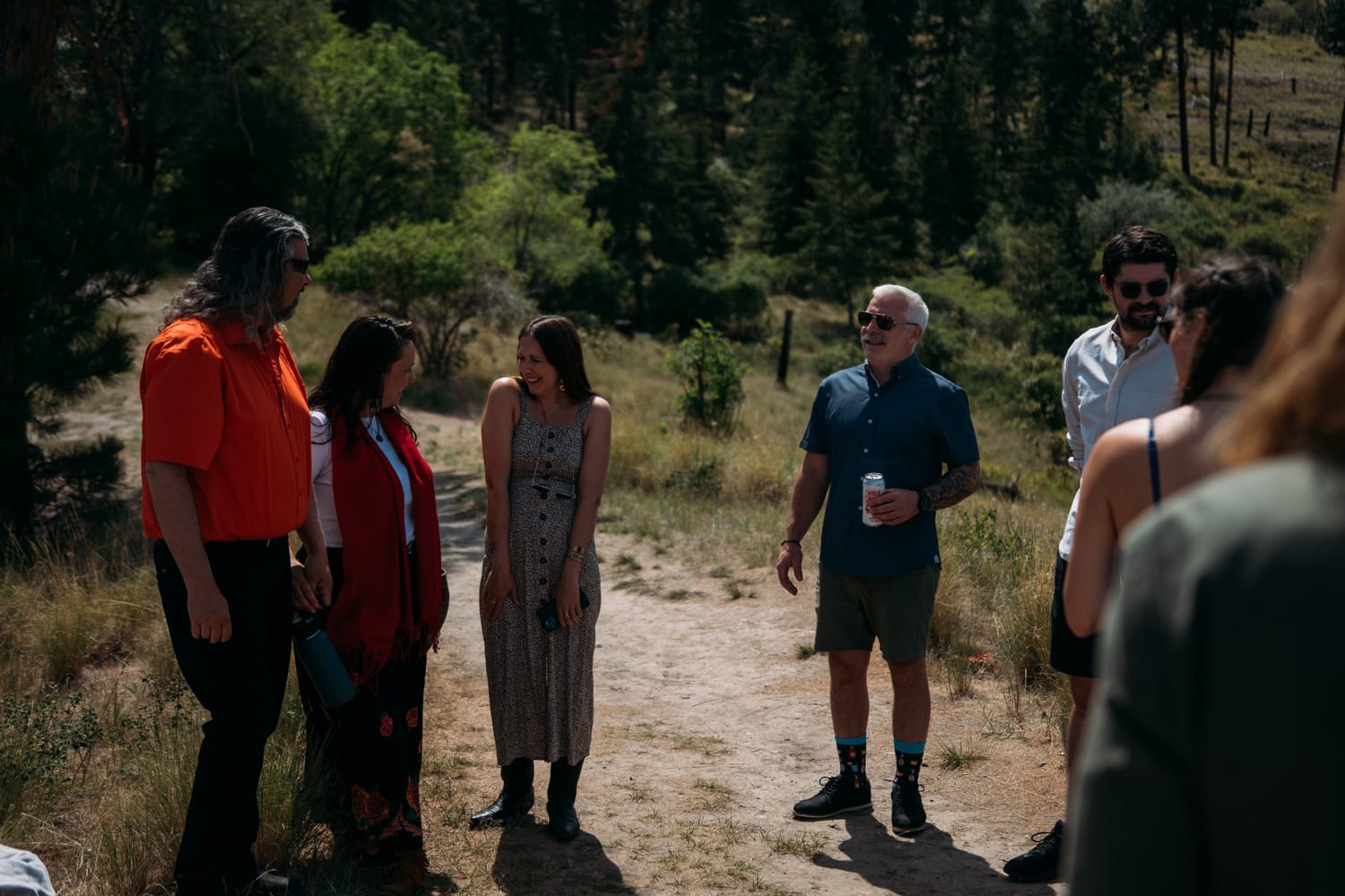 Kristina and Mark weddings story frame 6: A Bertram Creek wedding in South Kelowna with Okanagan Lake light, film-friend history, family texture and Lithuanian food and planning details..